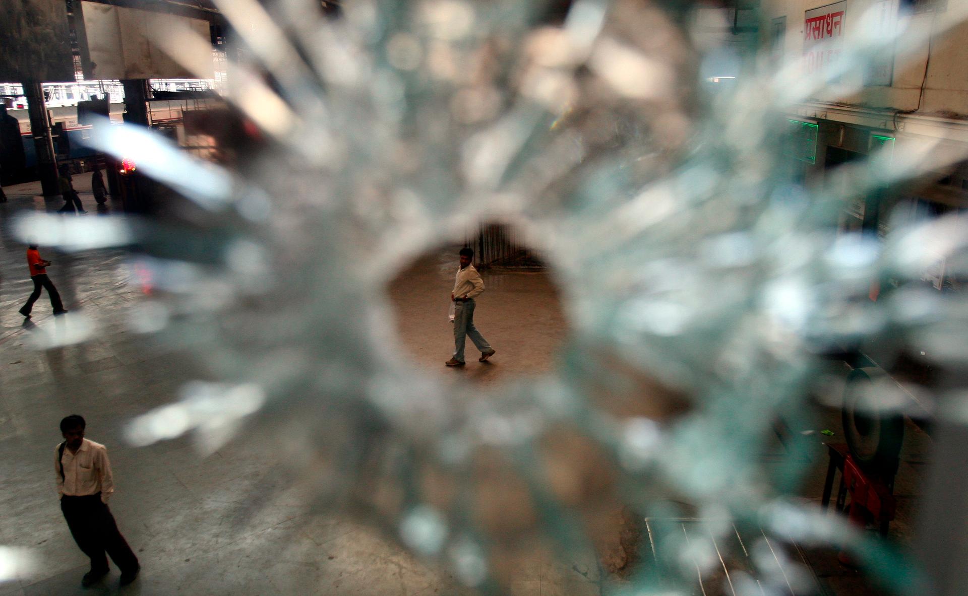 Restaurant window damaged in 2008's militant attack is seen at the railway station in Mumbai.