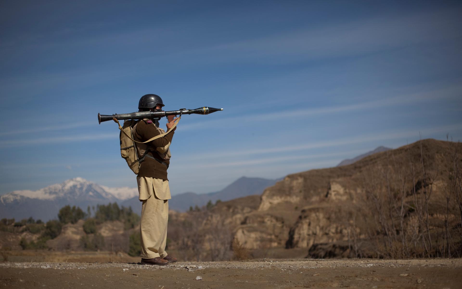 Pakistani soldier holds a rocket launcher.