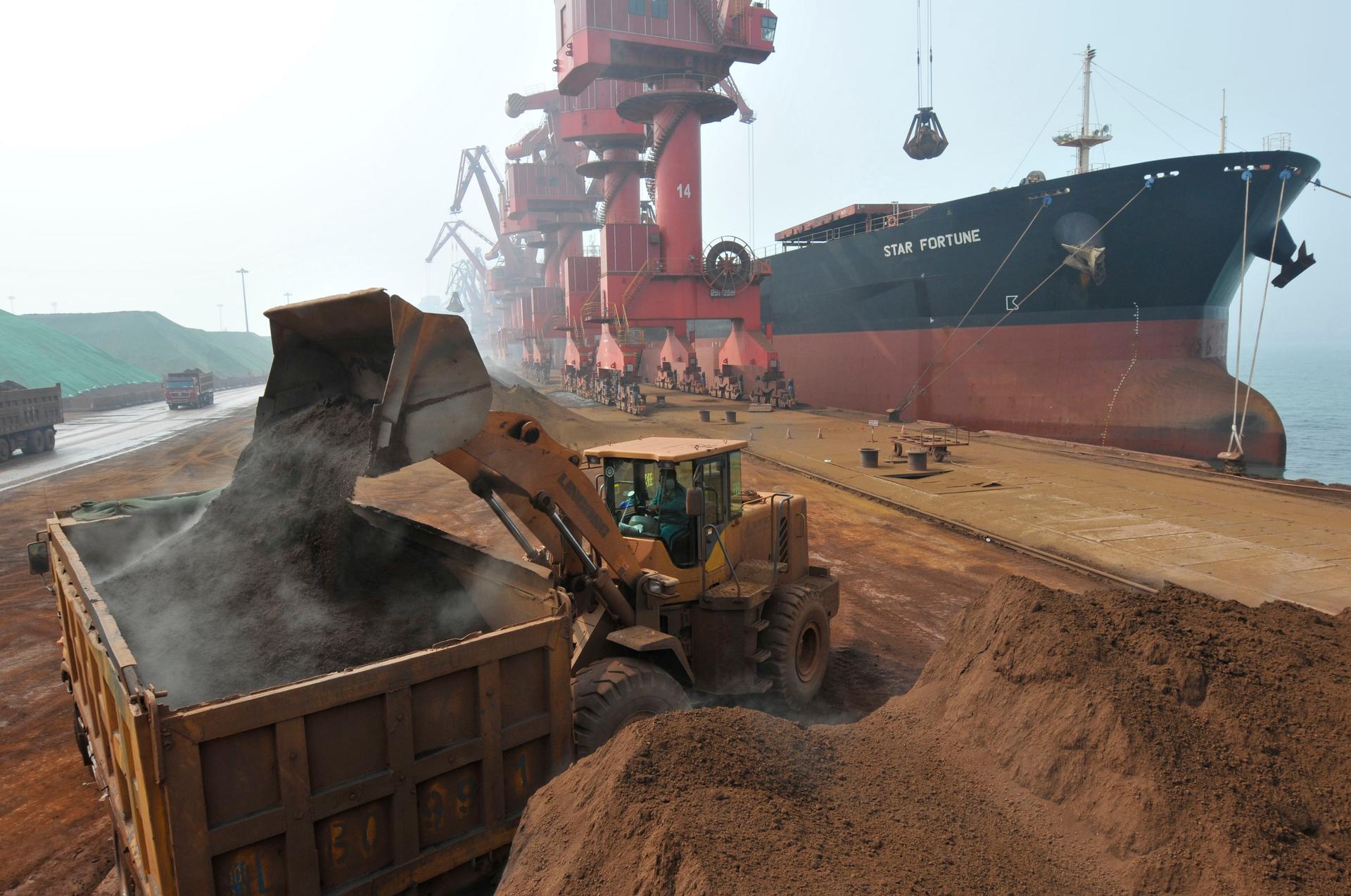 Iron ore is unloaded from the Star Fortune bulk carrier at Rizhao Port, one of China's biggest ports for importing the commodity, in Shandong province, in March 2010.