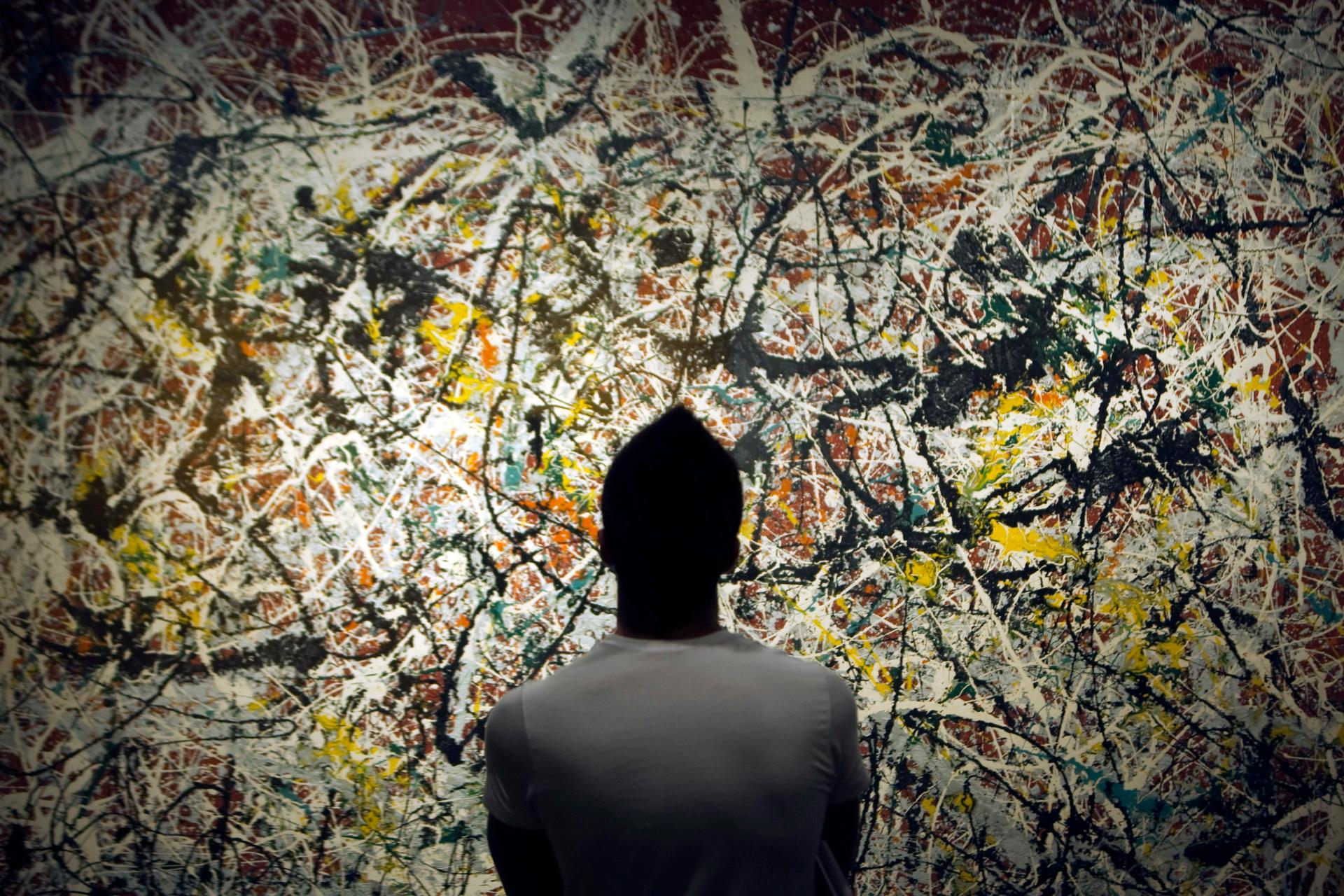 A Tehran Art University student looks at a painting by 20th century U.S. artist Jackson Pollock at Tehran's Museum of Contemporary Art June 19, 2010.