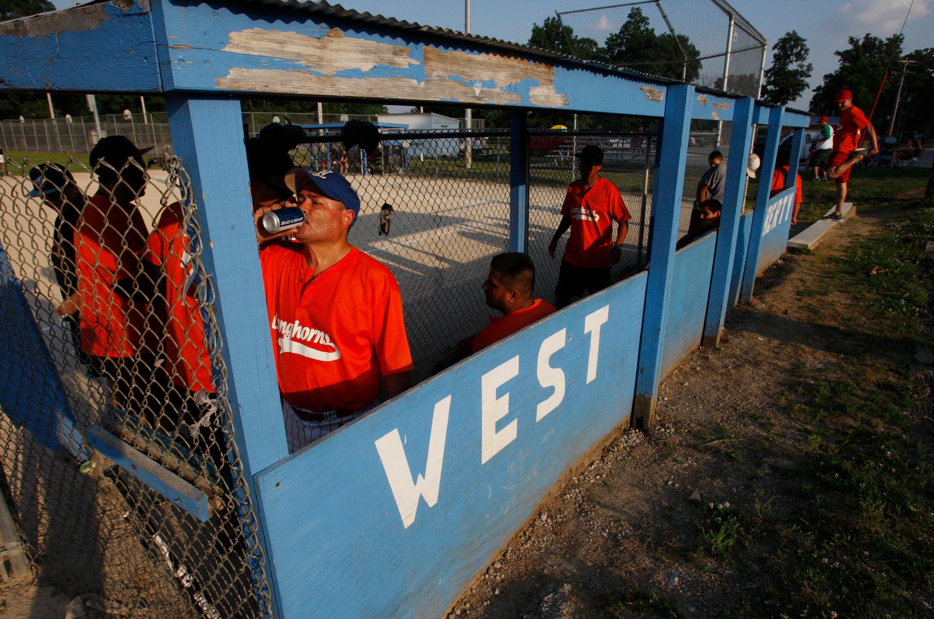 Members of the Longhorns compete in a Friday night softball game in West Liberty, Iowa