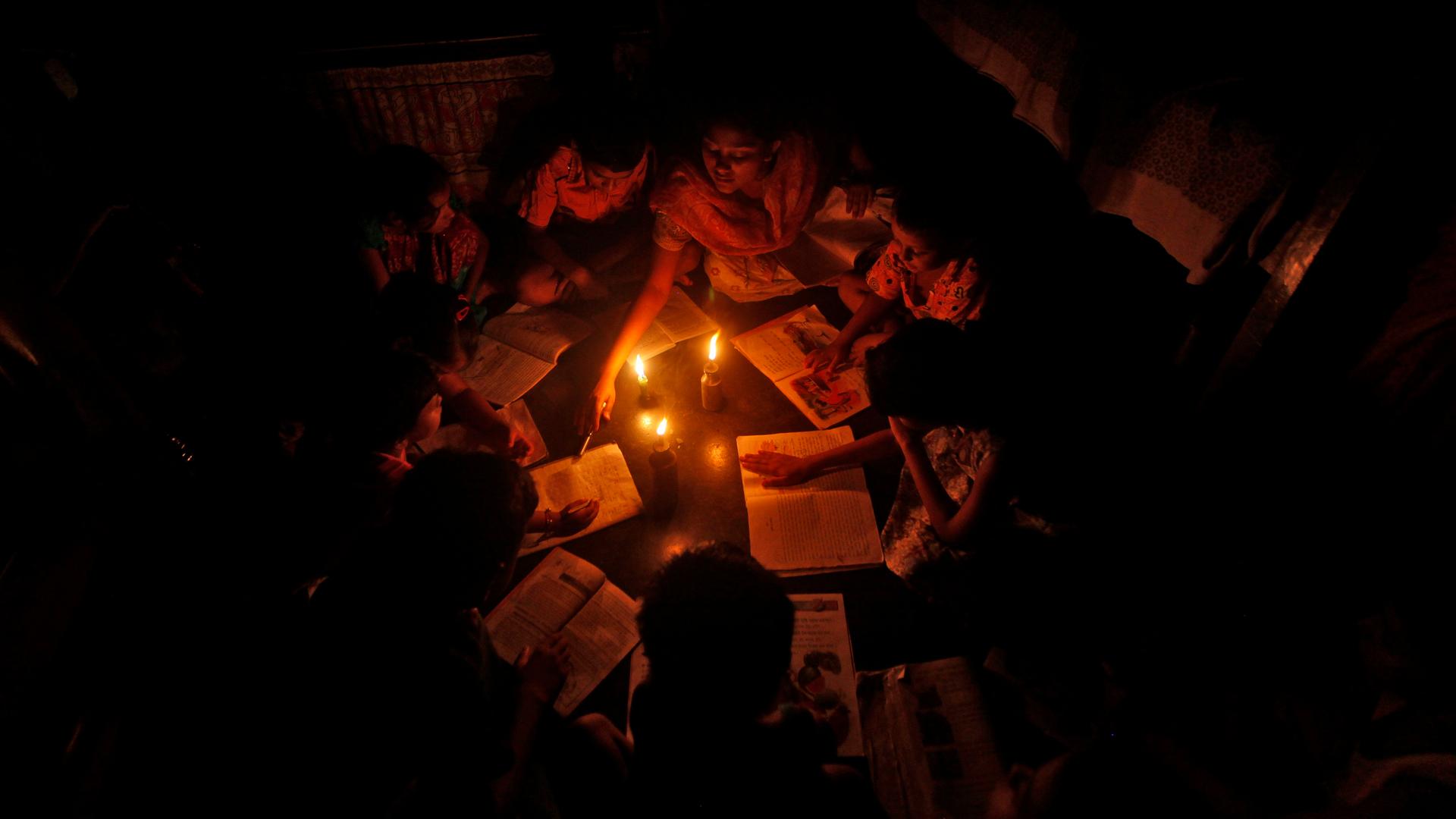 A teacher in Kolkata conducts a lesson during a particularly bad power outage that swept across India in July, 2012.