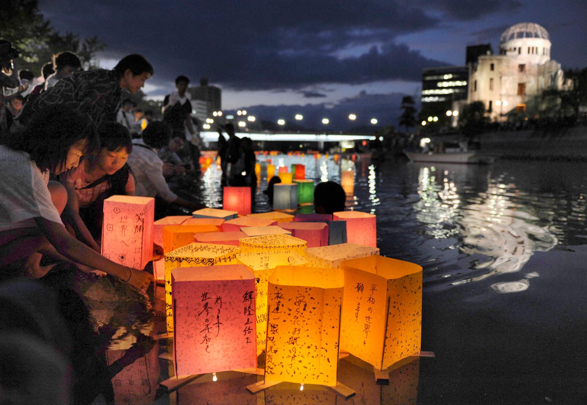 Hiroshima residents release paper lanterns on the Motoyasu river facing the gutted Atomic Bomb Dome in remembrance of atomic bomb victims on the 67th anniversary of the bombing.