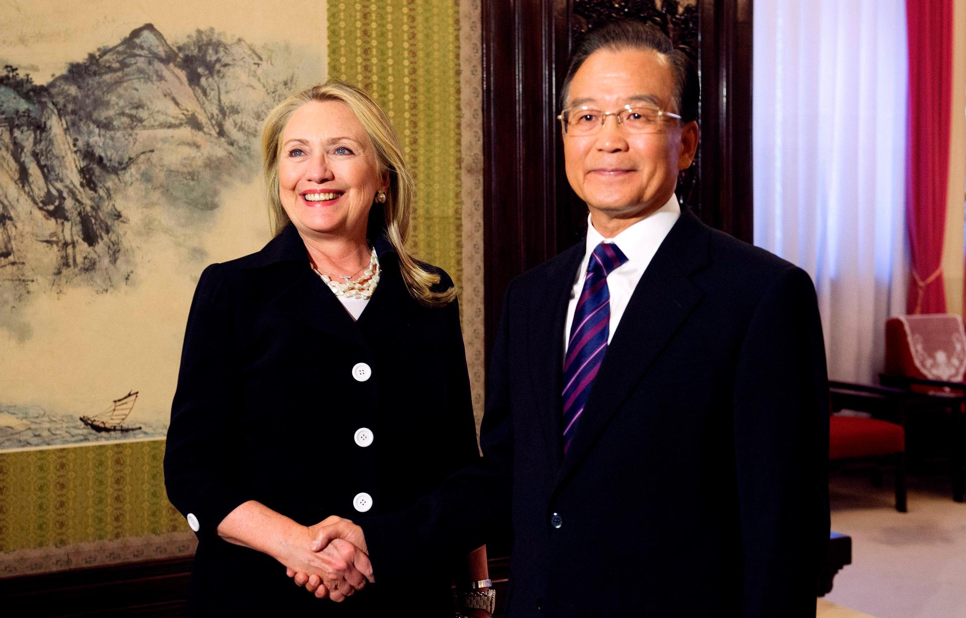 Chinese Premier Wen Jiabao and US Secretary of State Hillary Clinton shake hands at the Ziguangge Pavilion in the Zhongnanhai leaders' compound in Beijing on September 5, 2012.