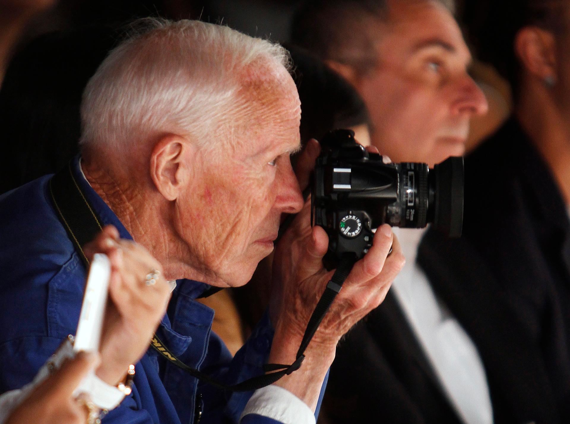 Bill Cunningham takes photos during the Naeem Khan Spring/Summer 2013 collection show at New York Fashion Week in 2012.