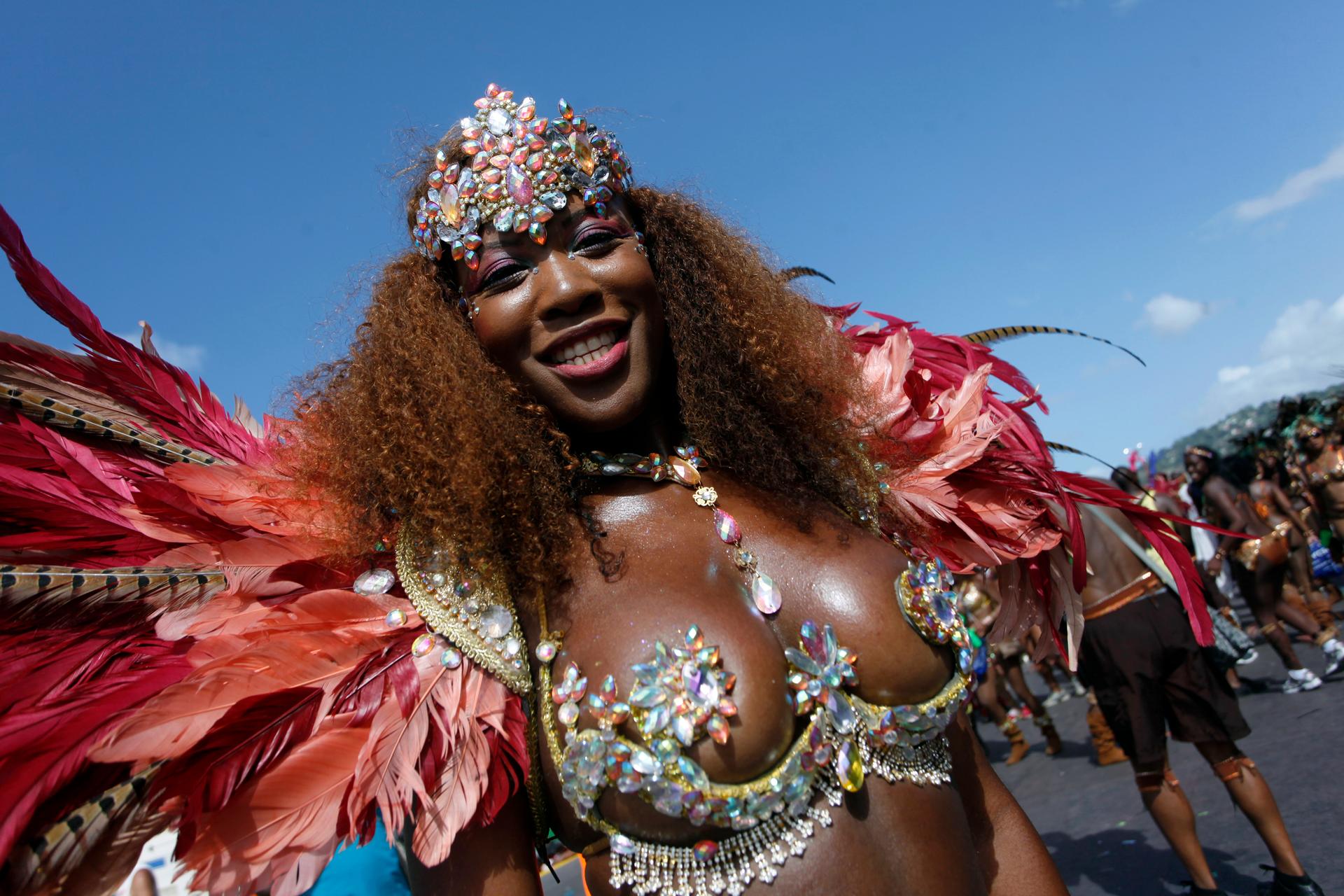 A masquerader during 2013 Carnival in Port of Spain, Trinidad and Tobago. This year, a Japanese tourist's murder spurred the mayor's resignation and a conversation about women's rights.