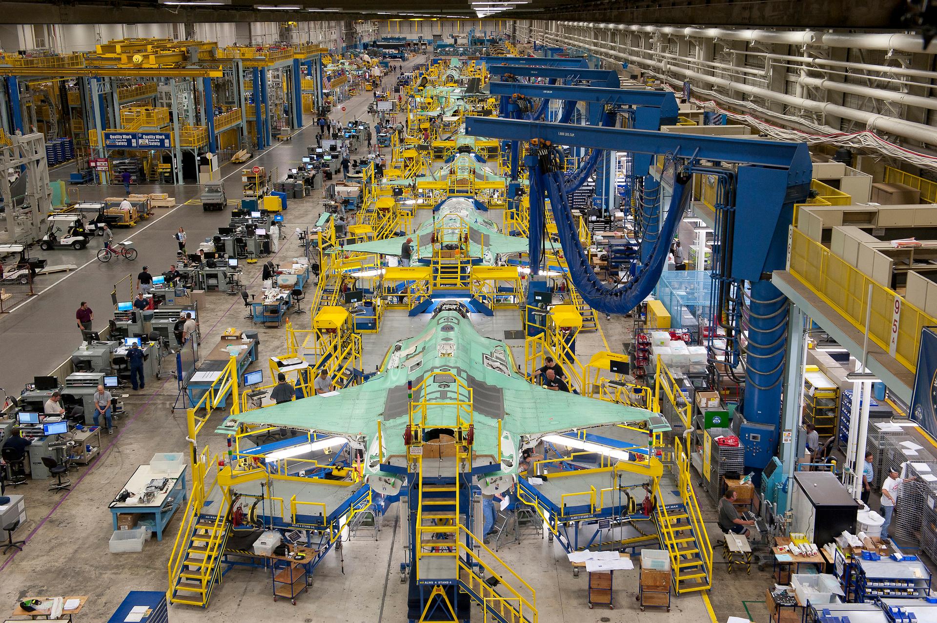 Workers can be seen on the moving line and forward fuselage assembly areas for the F-35 Joint Strike Fighter at Lockheed Martin Corp's factory located in Fort Worth, Tex
