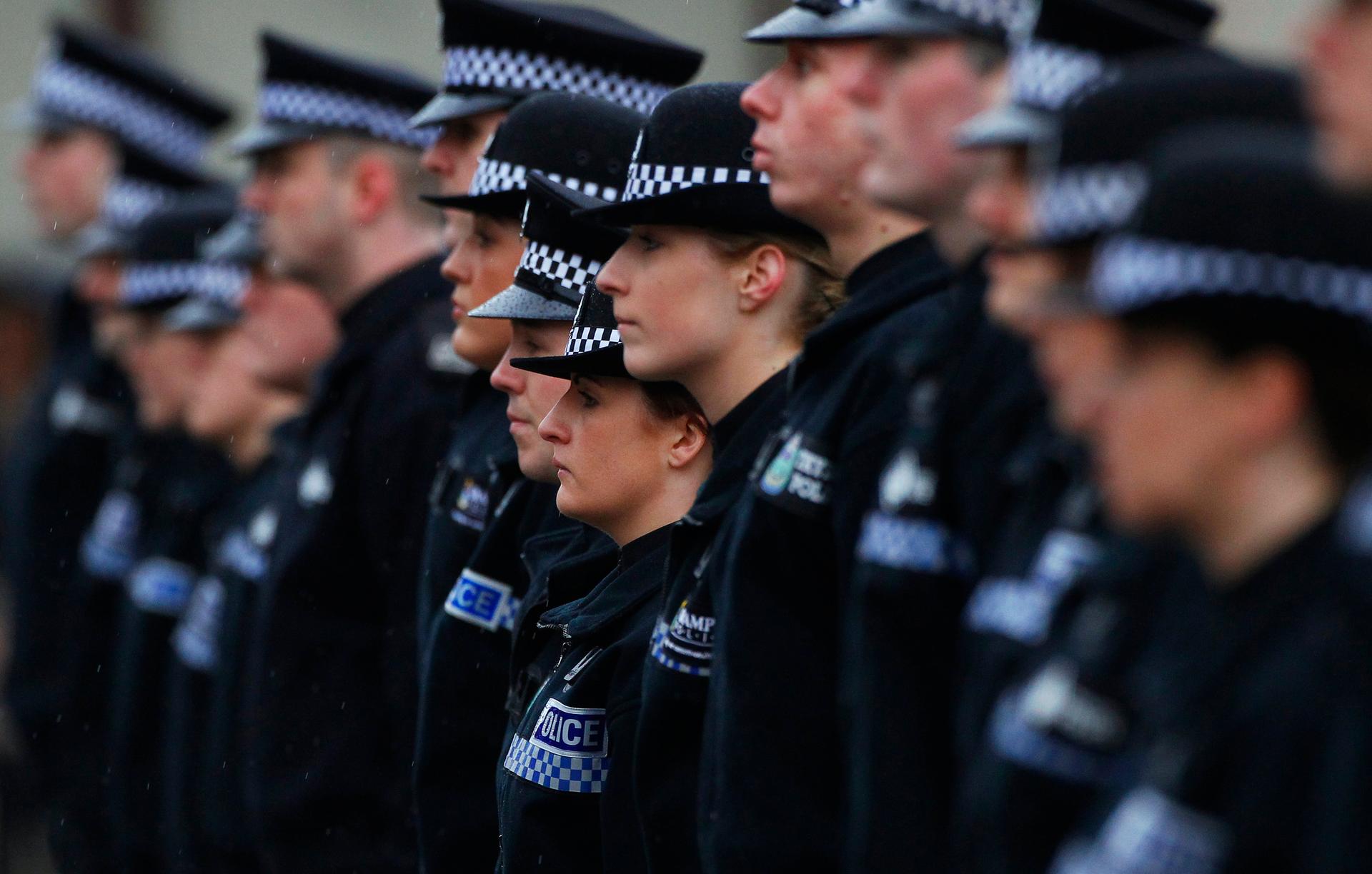 Police recruits stand to attention during their passing out parade at the Scottish Police College in Tulliallan, Scotland March 8, 2013.