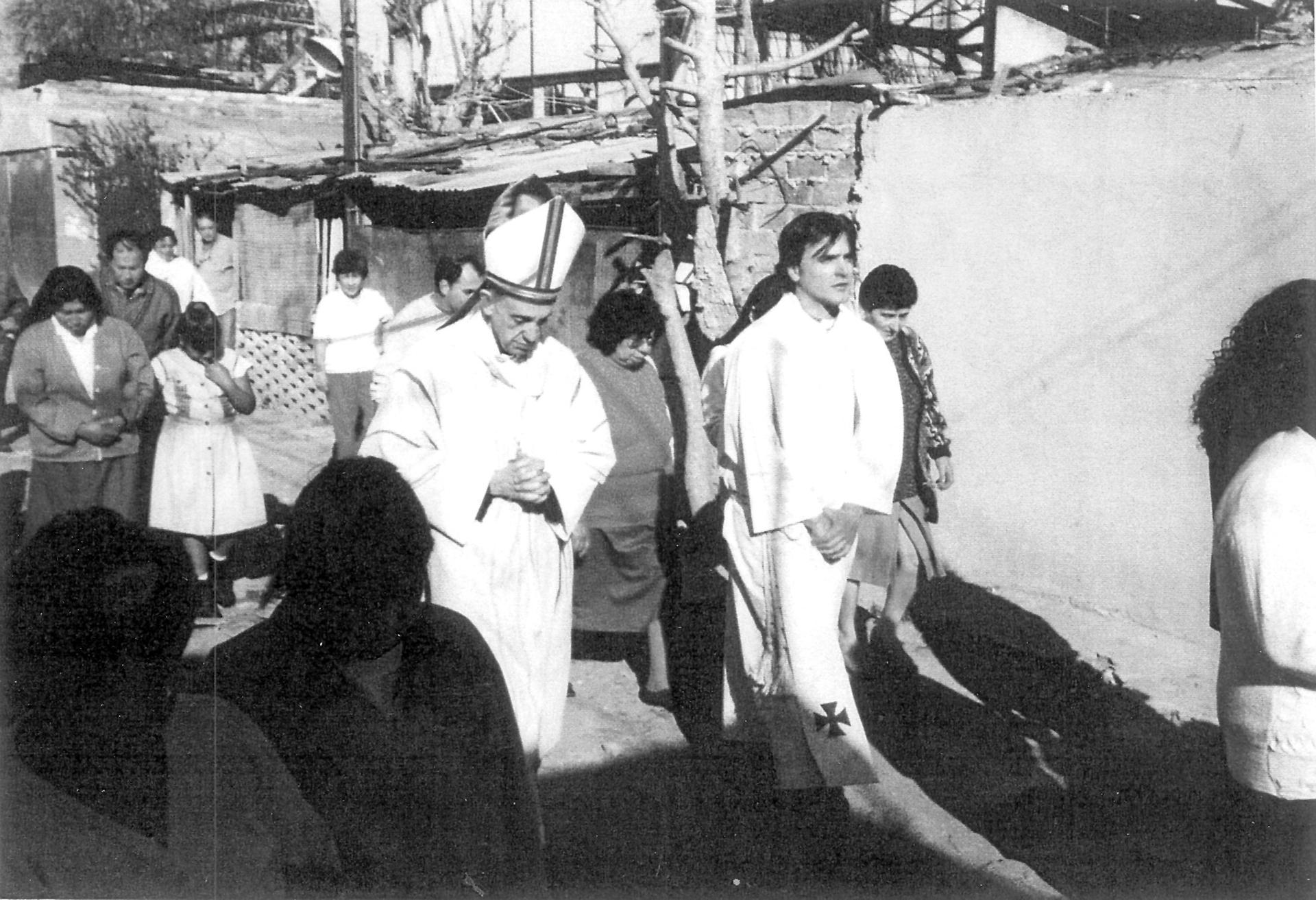 Jorge Mario Bergoglio (center) now known as Pope Francis visiting a Buenos Aires slum in 1998. 