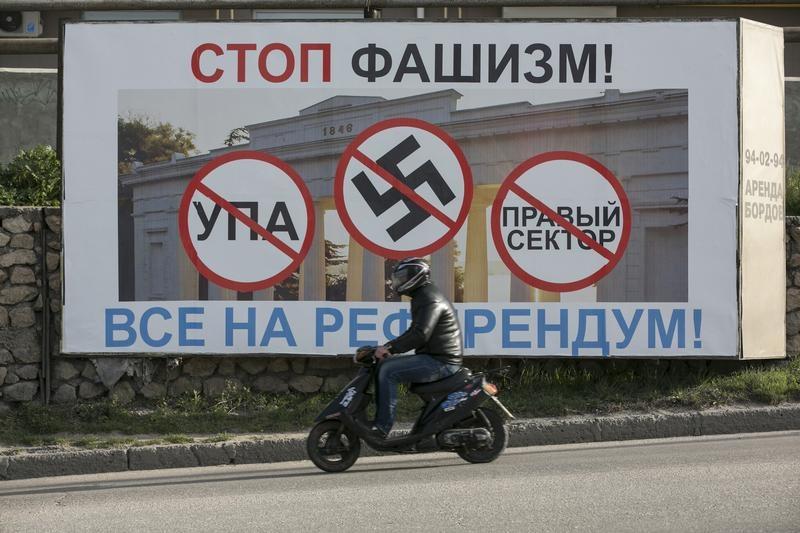 A billboard urged people to vote in Crimea's referendum. The poster reads, "Stop fascists everyone, come to the referendum" .