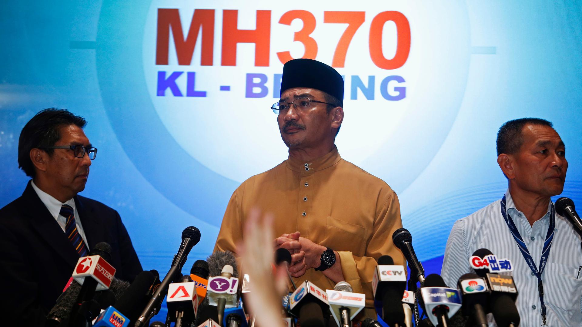 Malaysia's acting Transport Minister, Hishammuddin Tun Hussein, takes questions from journalists during a news conference about the missing Malaysia Airlines flight MH370.