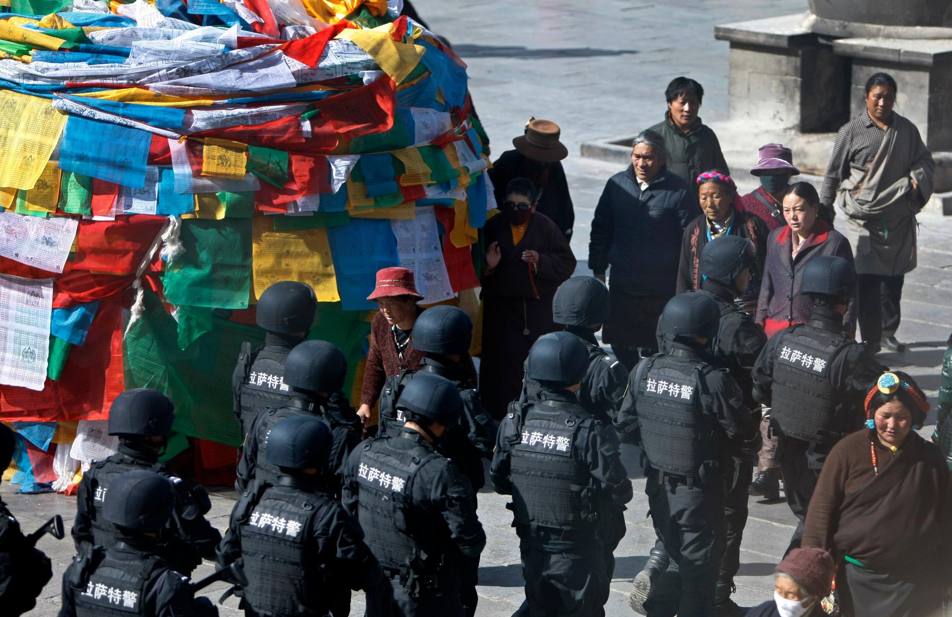 Chinese police patrolled outside Johkhang Monastery in the capital of the Tibet Autonomous Region of China in March 2014. Security forces always go on high alert around the sensitive March 10th anniversary. 