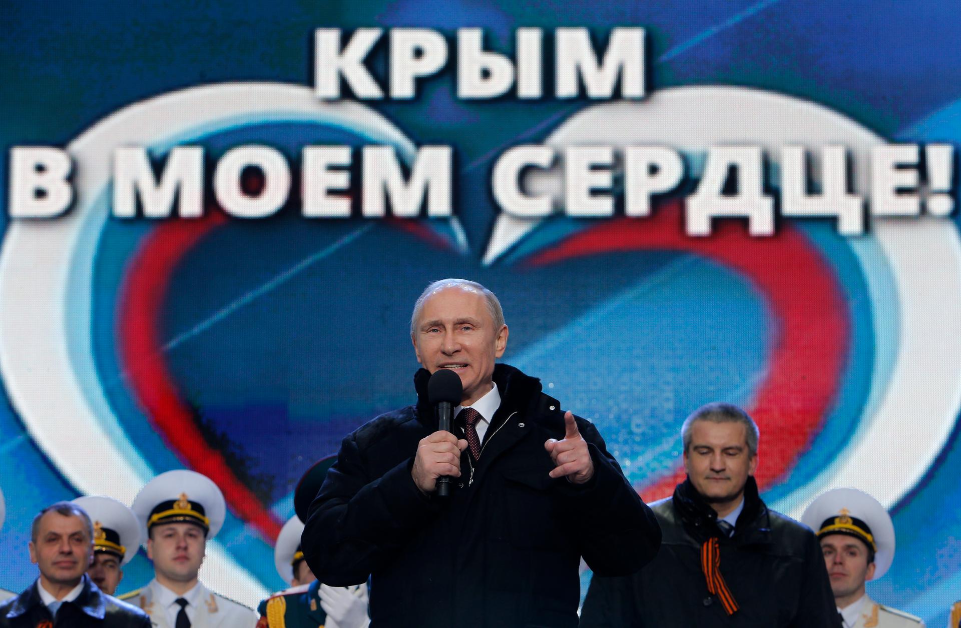 Russia's President Vladimir Putin addresses the audience during a March 18th rally and a concert in Moscow called "We are together" to support the annexation of Ukraine's Crimea to Russia. Defying Ukrainian protests and Western sanctions, Russia signed a