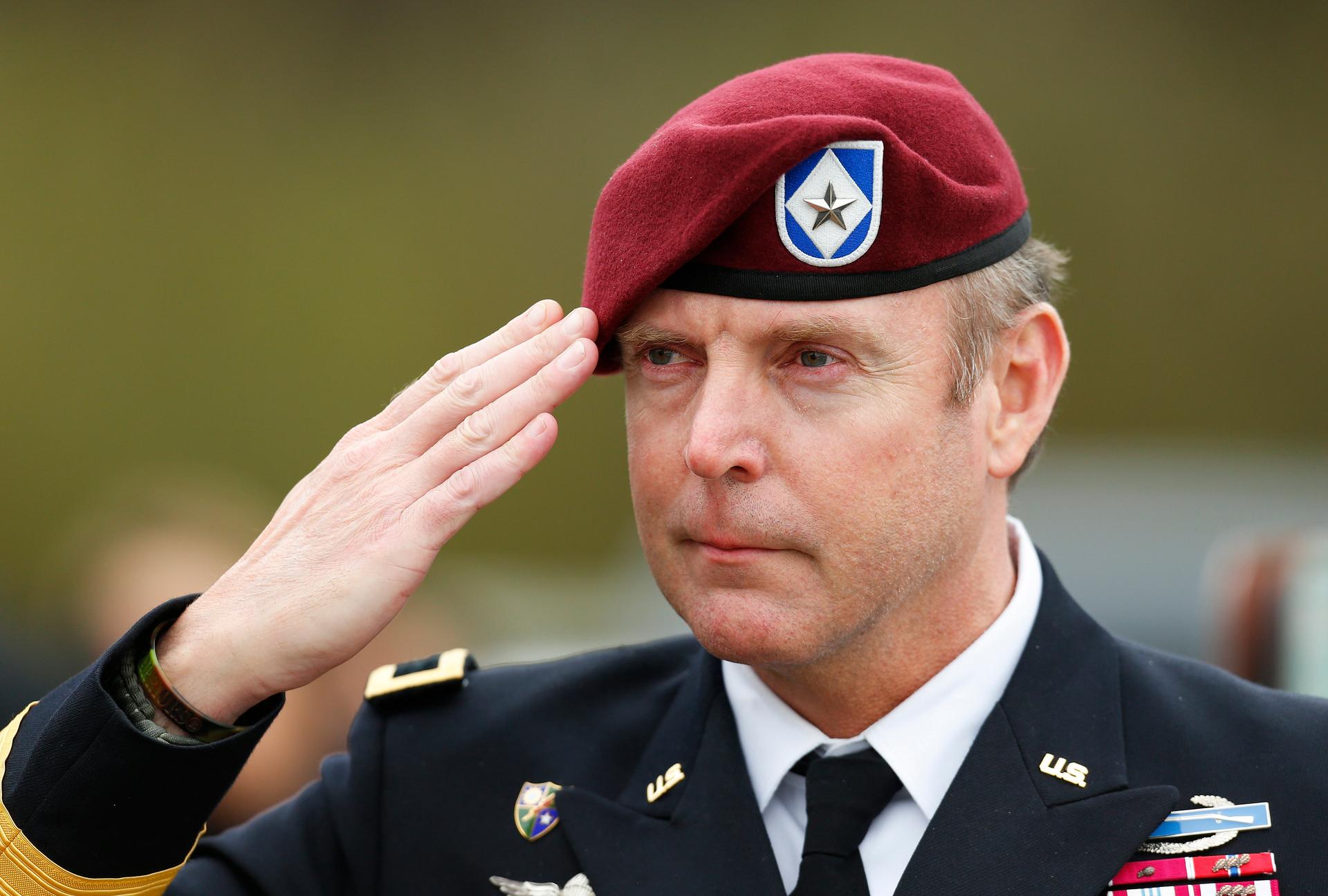 U.S. Army Brigadier General Jeffrey Sinclair salutes outside a North Carolina courthouse where he stood accused of bullying a junior officer into sex and threatening her life.