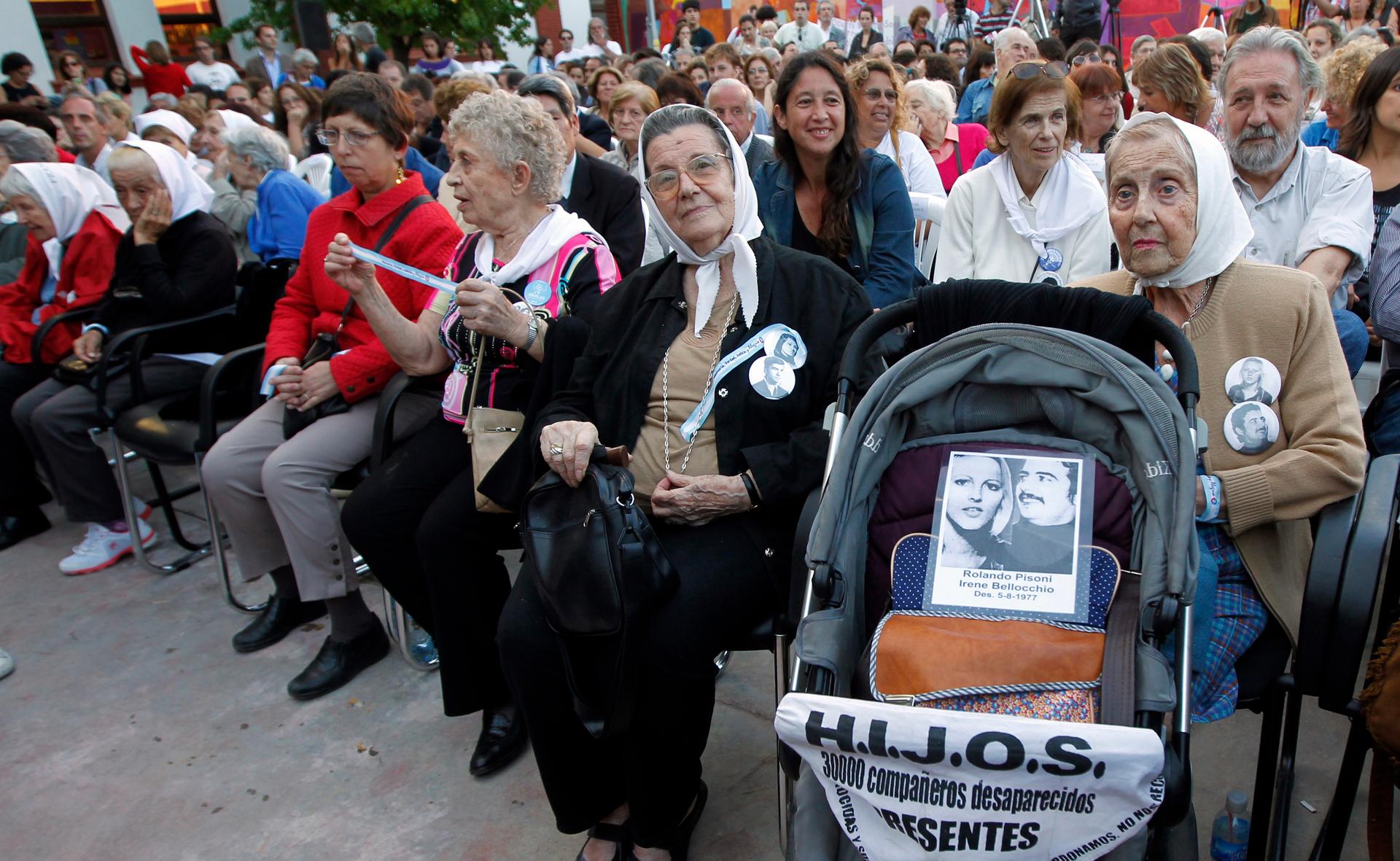 Aurora Zucco de Bellocchio, a member of human rights organization Madres de Plaza de Mayo (Mothers of Plaza de Mayo), sits behind a pram with a picture of her daughter Irene Bellocchio and her partner Rolando Pisoni, who both disappeared in 1977, during t