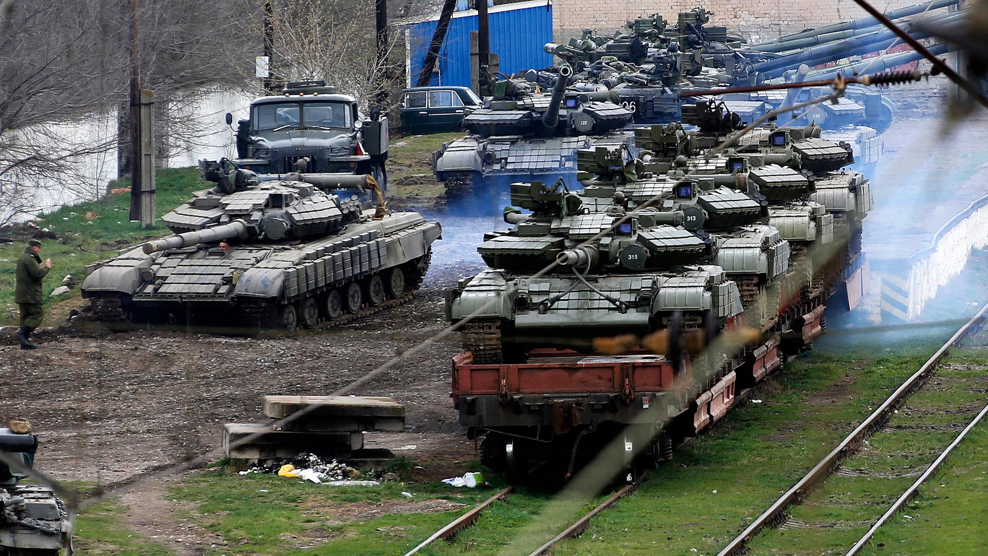 Russia has acquired control of considerable amounts of Ukrainian military equipment in Crimea. Here Russian soldiers are loading Ukrainian tanks onto a train in northern Crimea (Thursday). 