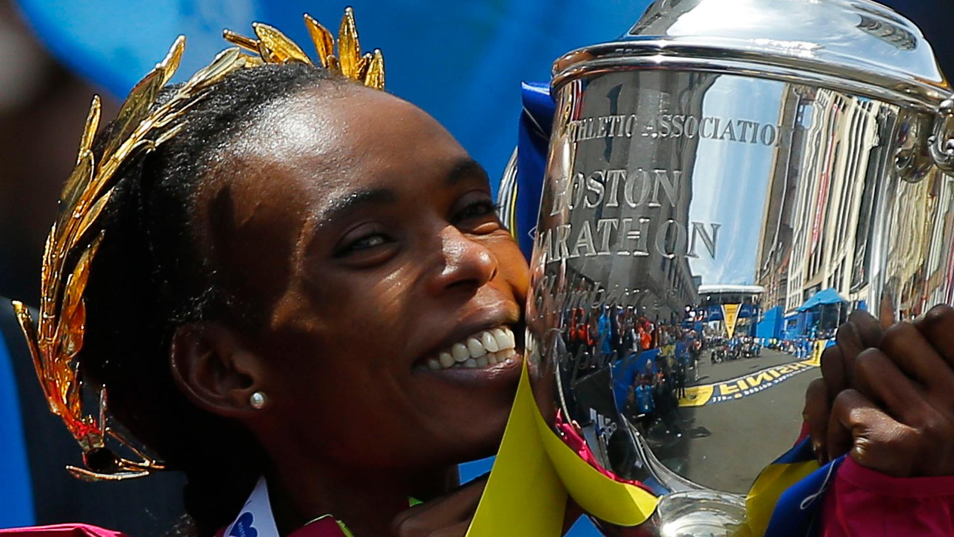 Kenya's Rita Jeptoo reacts after winning the women's division at the 118th running of the Boston Marathon in Boston, Massachusetts April 21, 2014. Jeptoo, winner of the Boston and Chicago Marathons for the last two years, has failed an out-of-competition 