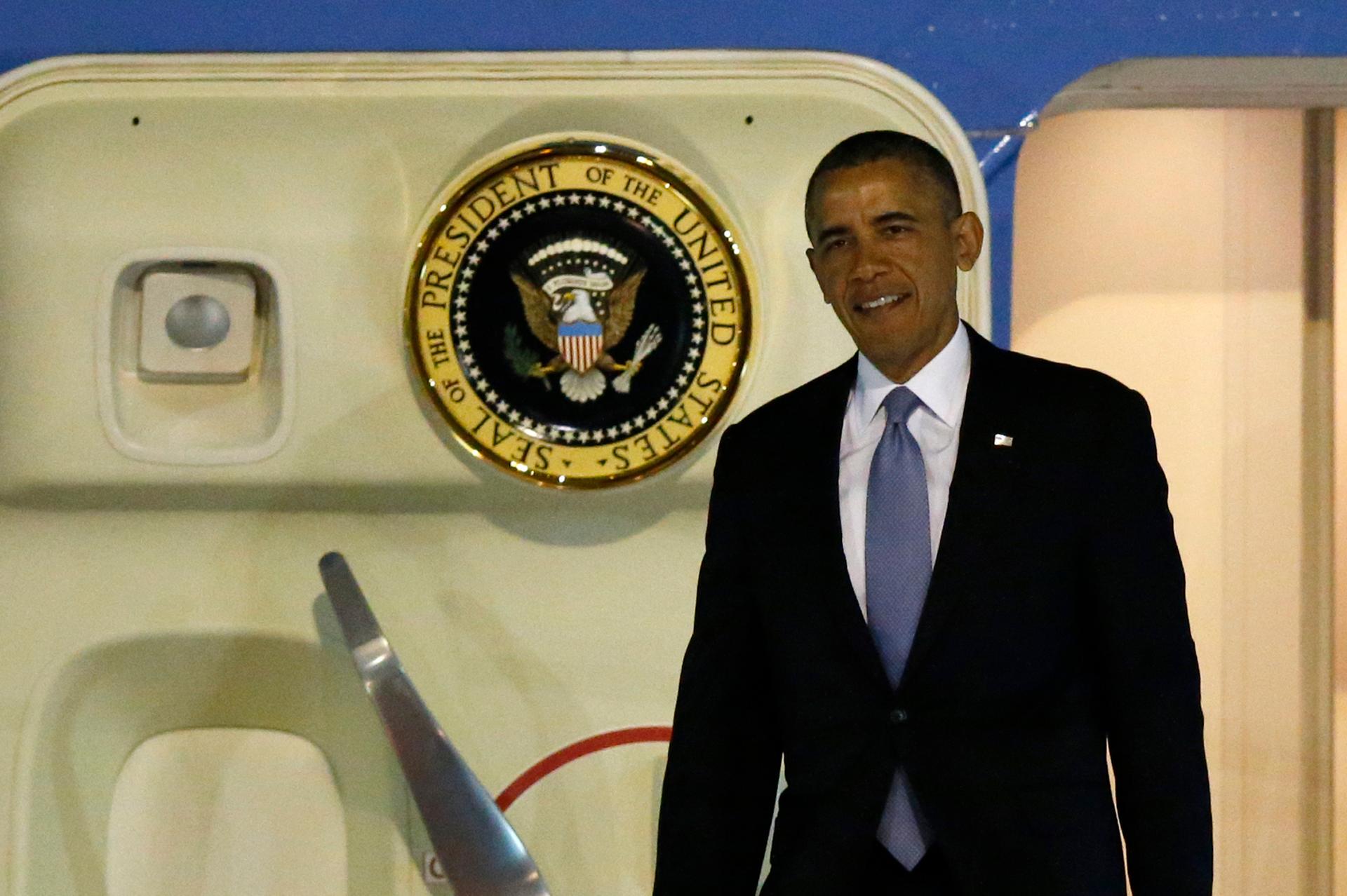 President Barack Obama steps out from Air Force One as he arrives in Tokyo. He's starting a four-nation trip that comes at a time of rising tension in the region, and concerns about US credibility.