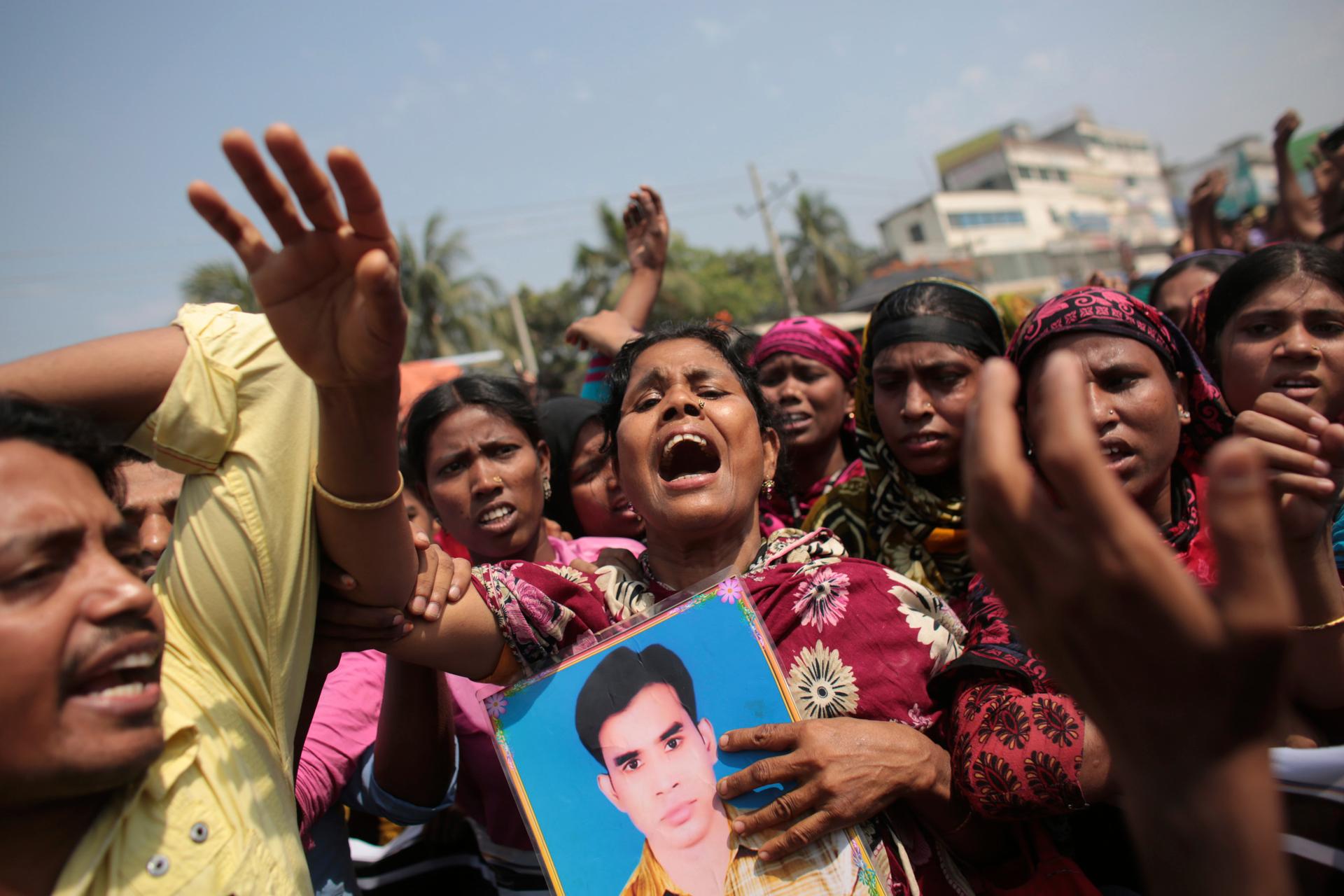 Relatives of victims killed in the collapse of Rana Plaza mourn on the first year anniversary of the accident. More than 1,100 factory workers were killed when the garment factory complex the worked in collapsed.  Today, the owner of the building was char