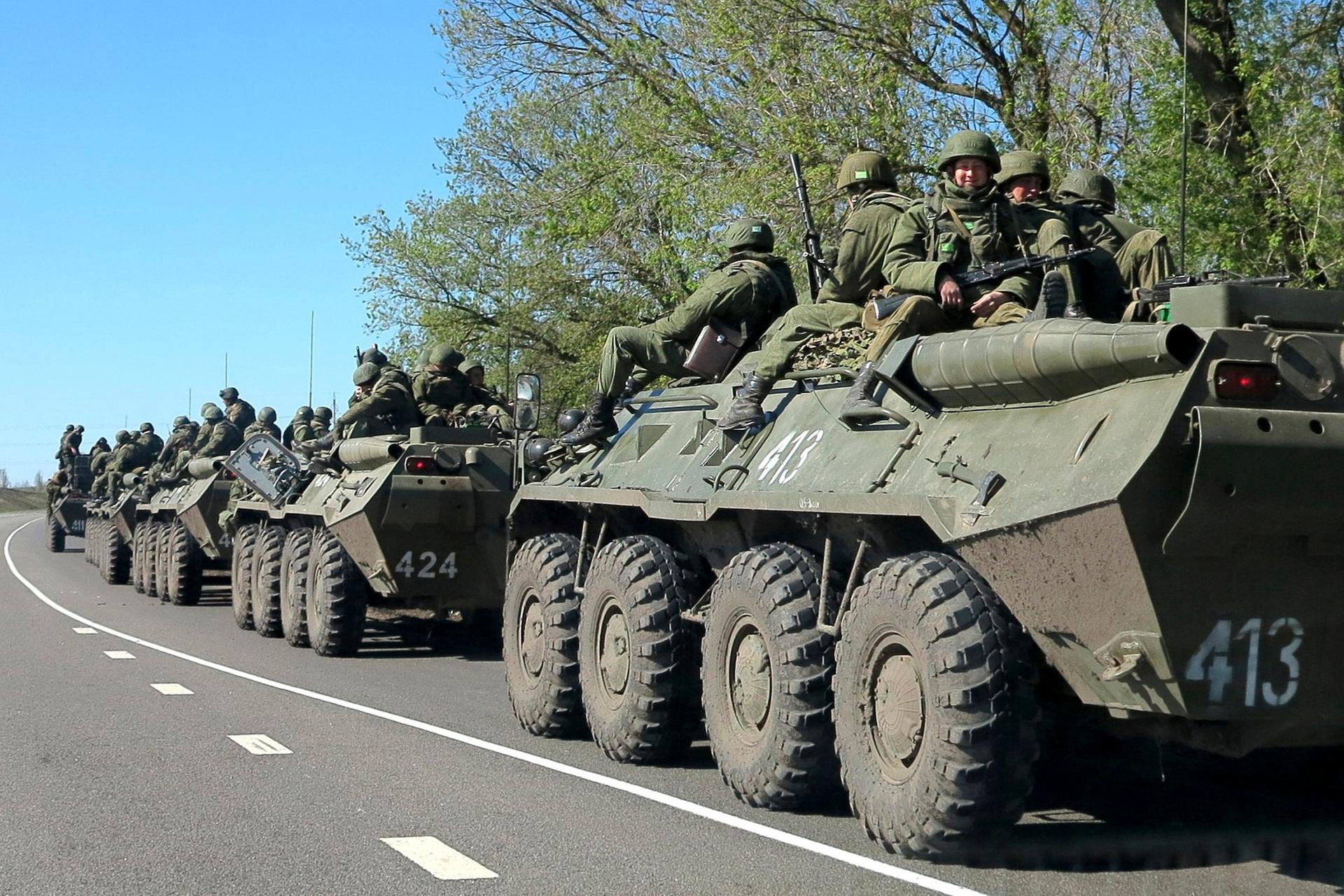 Russian troops on the move Friday, on the outskirts of the city of Belgorod, just a few miles from the border with Ukraine.
