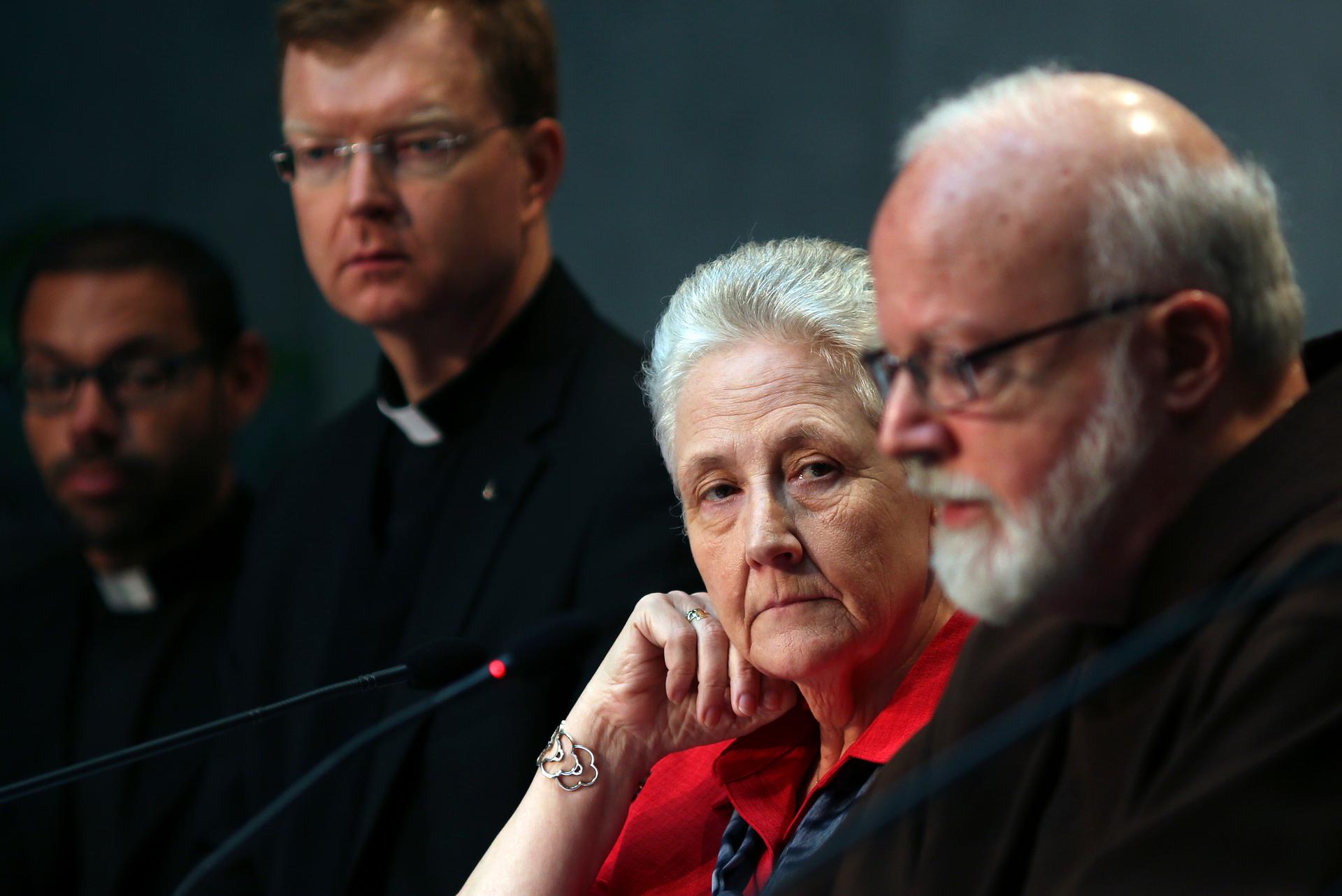 Marie Collins (2nd from right), who served as a memer of the Pontifical Commission for the Protection of Minors, watches as Cardinal Sean Patrick O'Malley (right) speaks during their briefing at the Holy See’s press office at the Vatican in Rome on May 3,