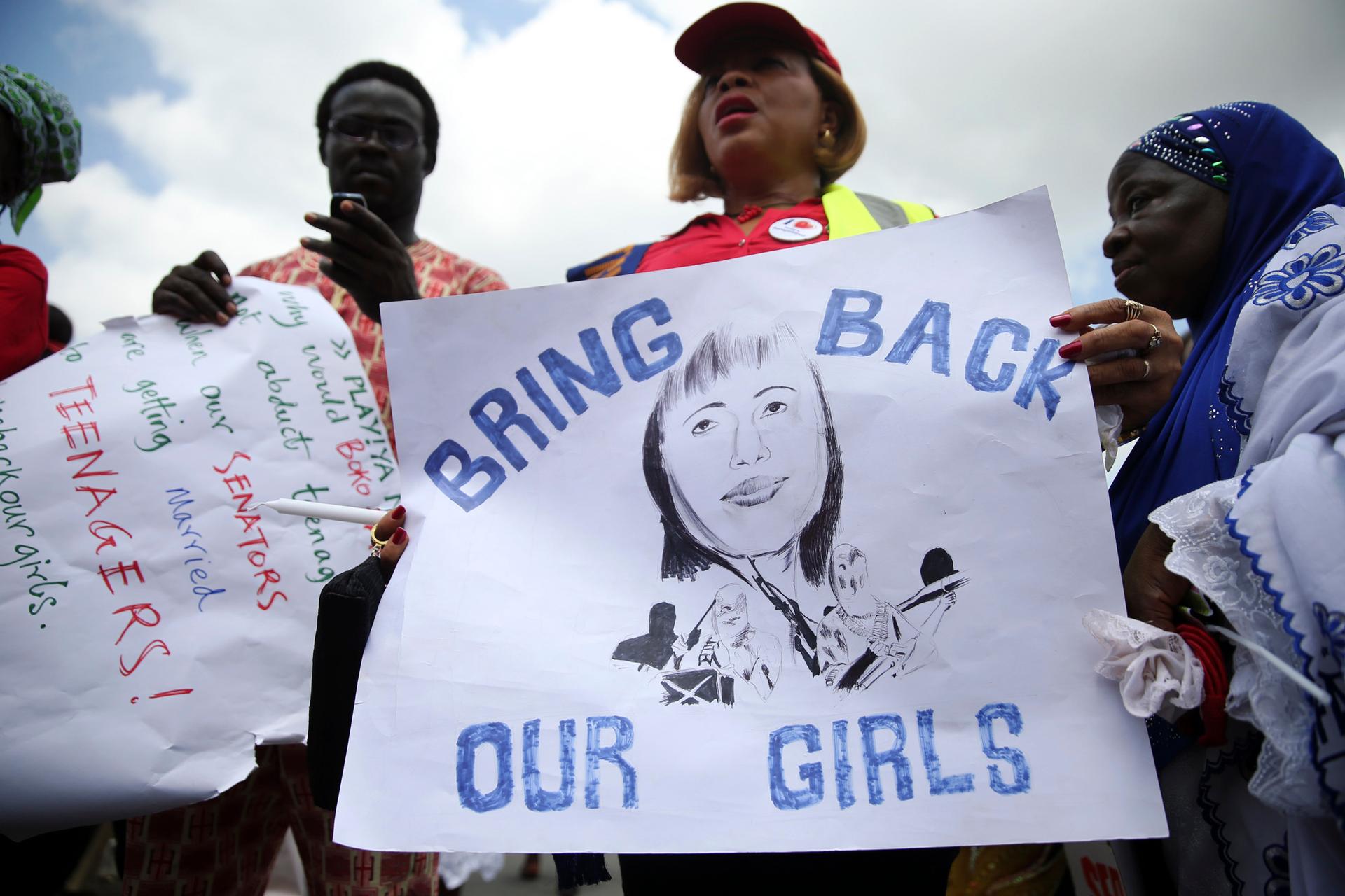 People take part in a protest demanding the release of abducted secondary school girls from the remote village of Chibok, Nigeria. The Islamist militant group Boko Haram claimed responsibility for the abduction of more than 200 schoolgirls 