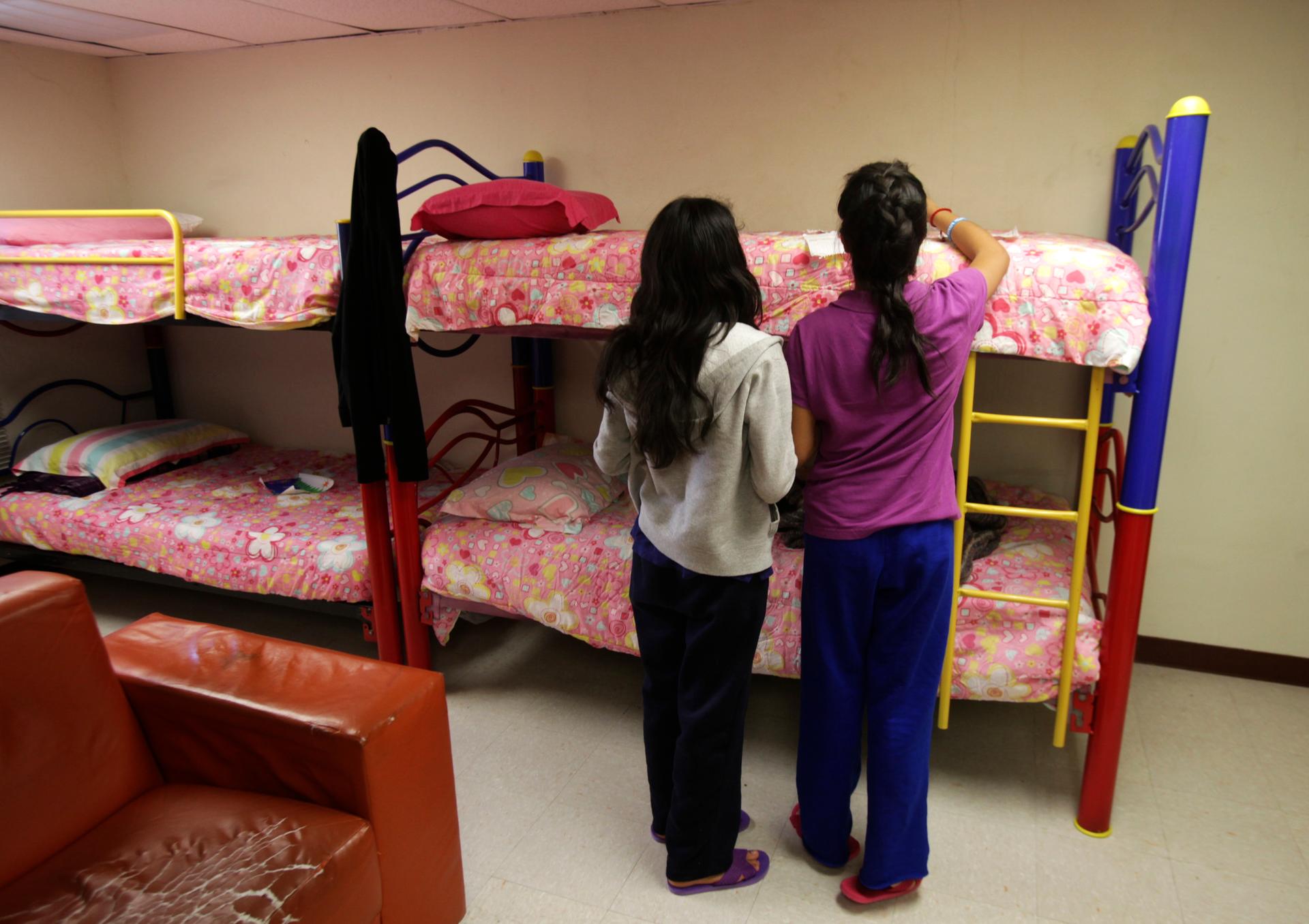 Girls stand in a dorm at the shelter for underage immigrants and repatriated minors in Ciudad Juarez, Mexico.