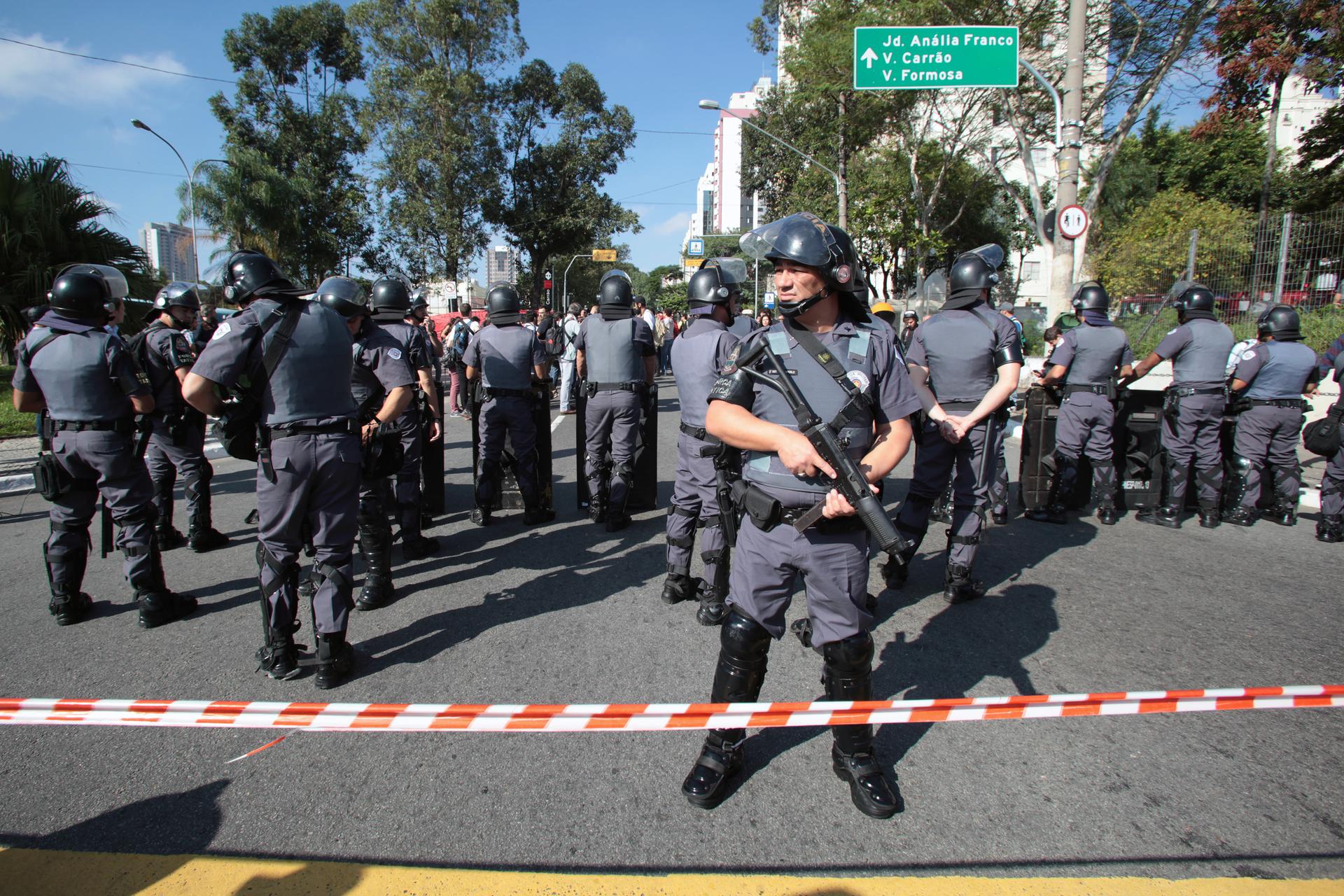 Riot police block demonstrators during a protest against the 2014 World Cup, in Sao Paulo June 12, 2014.