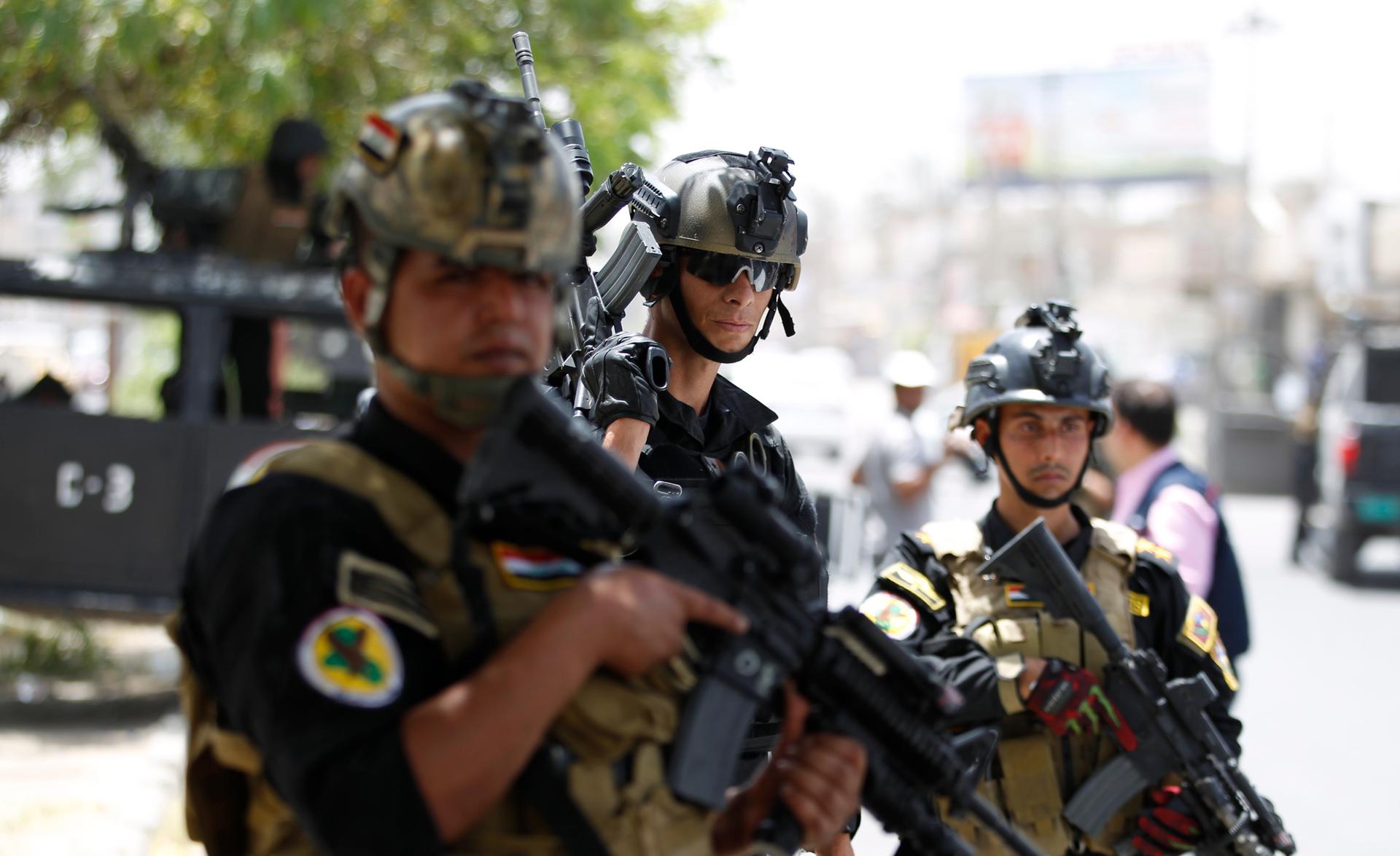 Members of the Iraqi Special Operations Forces take part in an intensive security deployment in Baghdad's Amiriya district, June 18, 2014. 
