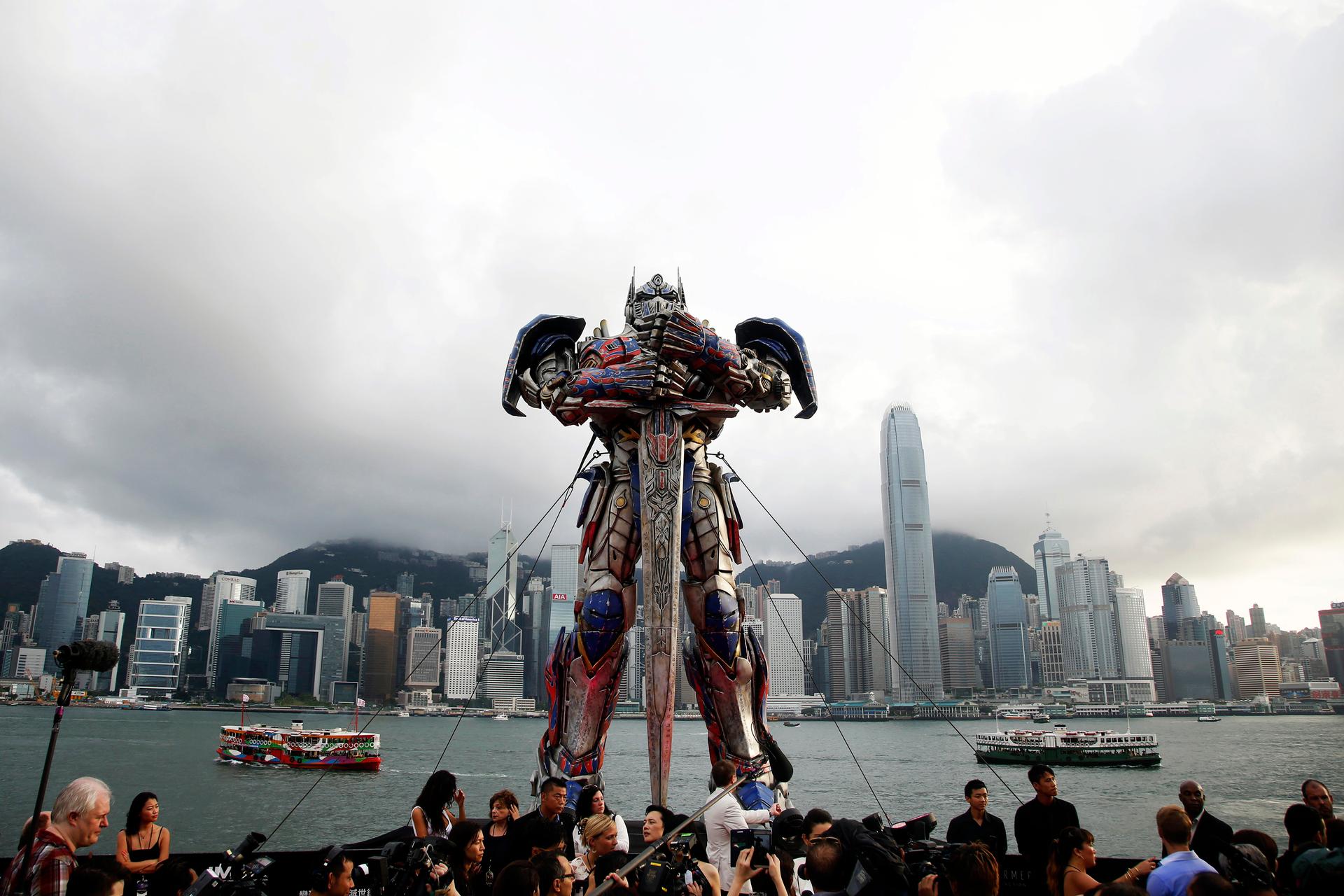 A 21-foot tall model of the Transformers character Optimus Prime is displayed on the red carpet before the world premiere of the film "Transformers: Age of Extinction" in Hong Kong.
