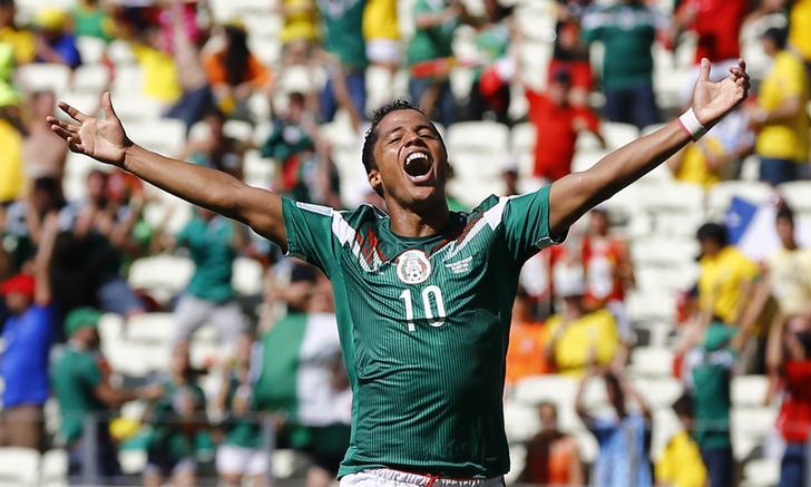 Giovani Dos Santos celebrates after scoring a goal for Mexico at the 2014 World Cup