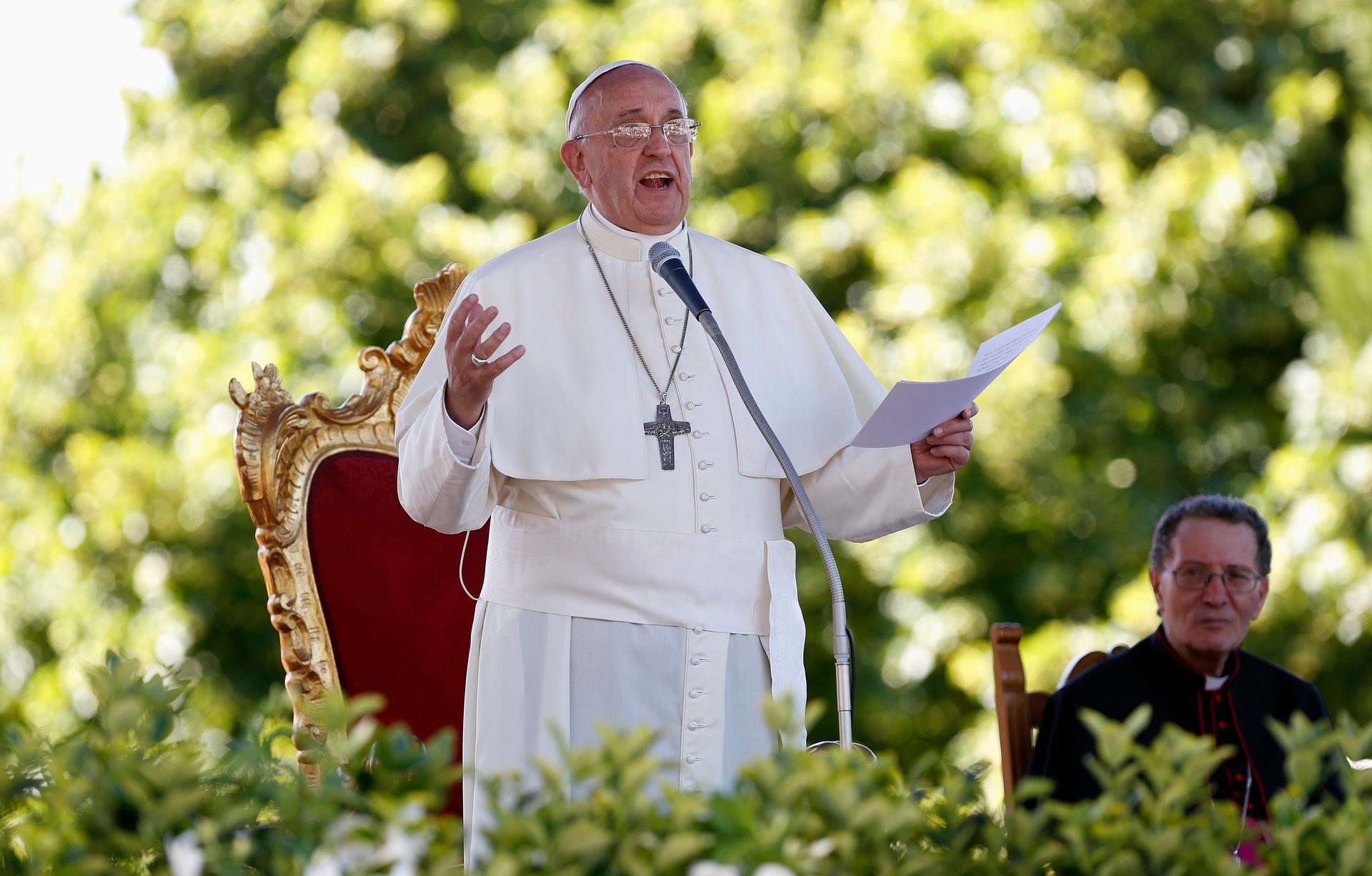 Pope Francis speaks outside the Castelpetroso sanctuary near Isernia in southern Italy on July 5, 2014. During the speech, he told students that environmental damage was a sin.