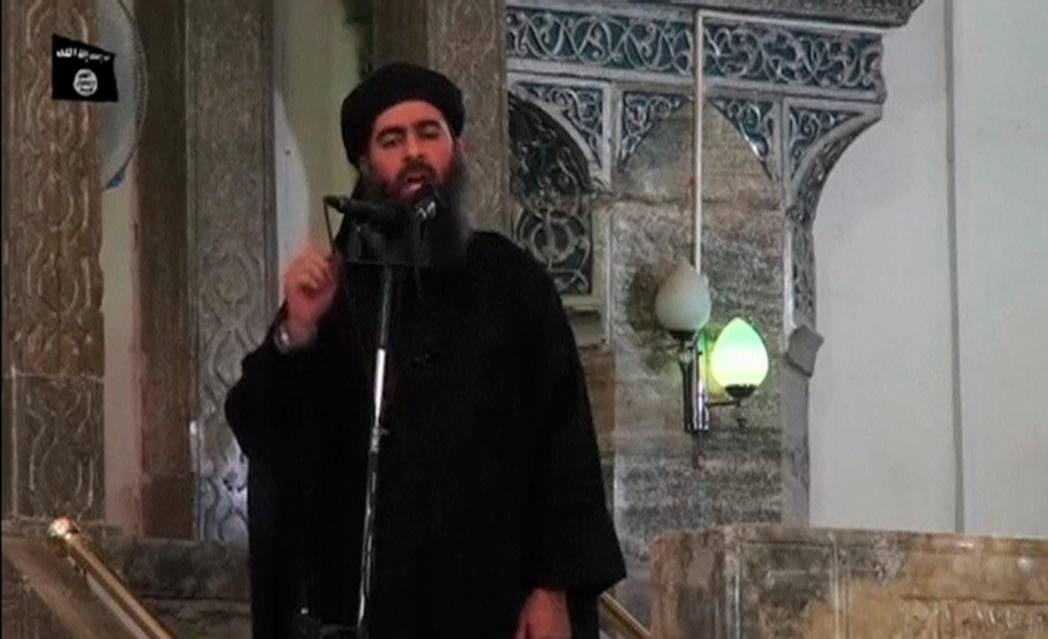 A man purported to be Abu Bakr al-Baghdadi, the leader of the miltant group ISIS, during what would have been his first public appearance at a mosque in Mosul, according to a video recording posted on the Internet.