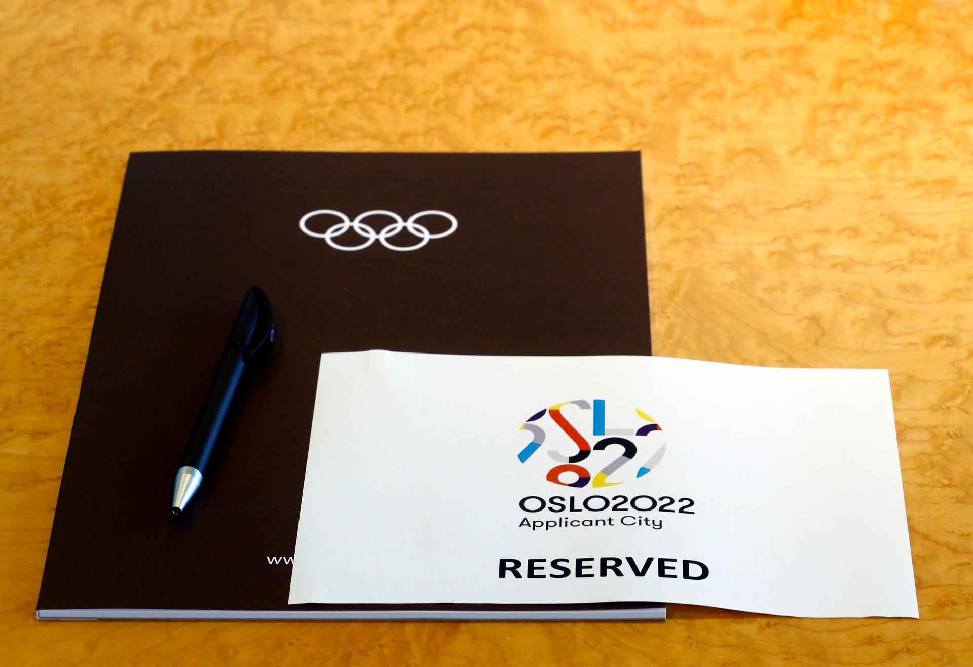 A sign is placed on a table for members of the Oslo 2022 delegation at the start of the Executive Board meeting at the International Olympic Committee (IOC) headquarters in Lausanne July 7, 2014. Oslo withdrew its Olympic bid in October, 2014.