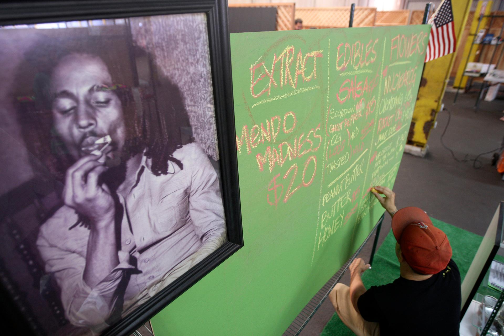 A portrait of Bob Marley hangs in a market in Los Angeles