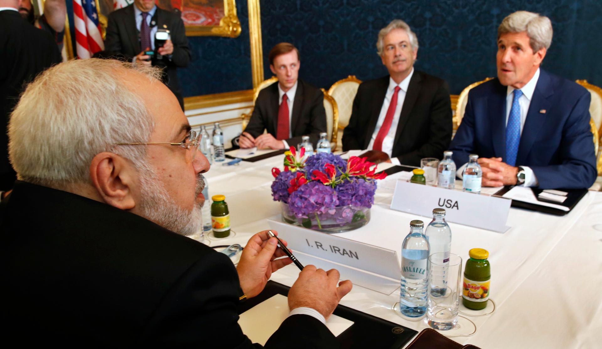 Iran's Foreign Minister Javad Zarif (L) holds a bilateral meeting with U.S. Secretary of State John Kerry (R) on the second straight day of talks over Tehran's nuclear program in Vienna, July 14, 2014.