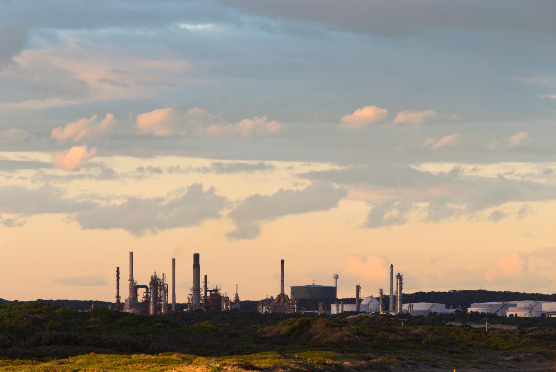 An oil refinery is pictured in the southern Sydney suburb of Kurnell. After the scrapping of Australia's carbon tax, companies will be allowed to voluntarily reduce emissions without requirements for reductions.