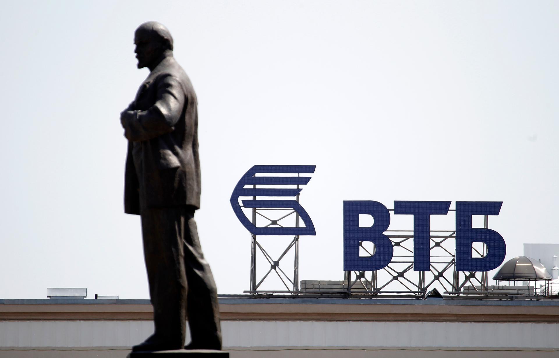 Russian-owned VTB Bank will be impacted by EU sanctions against Russia's economy. A monument of Soviet state founder Vladimir Lenin stands on the top of a building.  