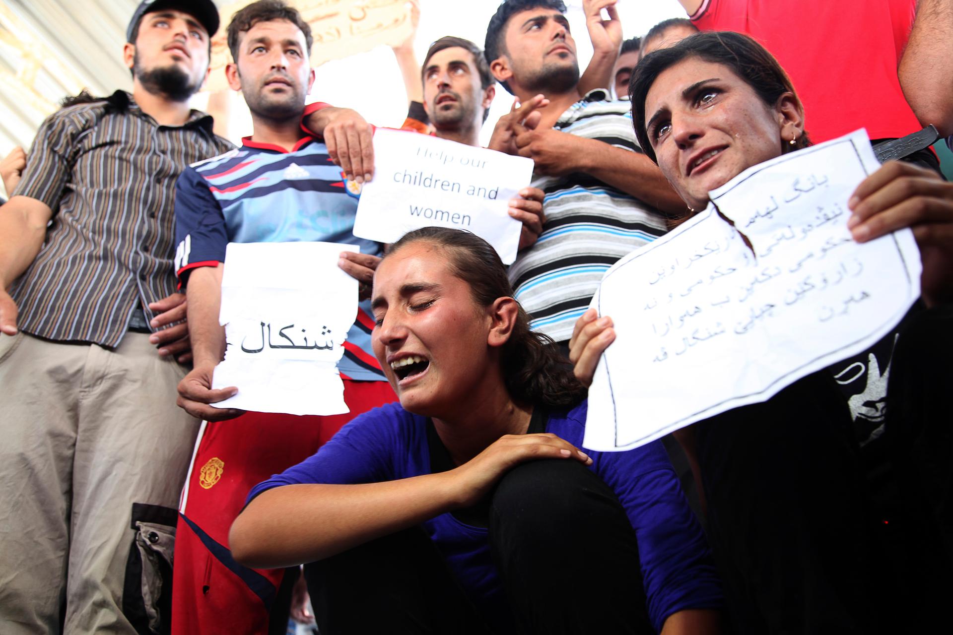 Displaced demonstrators from the minority Yazidi sect gather during a protest against militants of ISIS in Irbil on August 4, 2014.