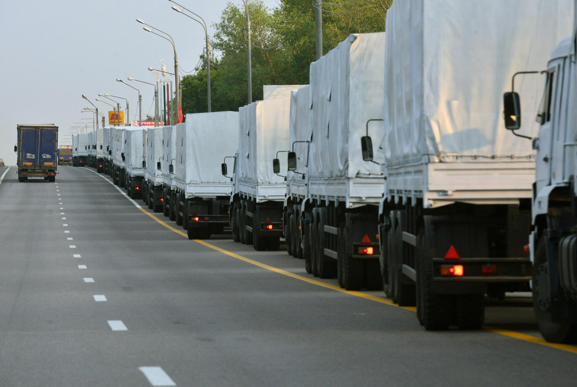 A Russian convoy of trucks carrying humanitarian aid for Ukraine stops along a road in the city of Voronezh August 12, 2014. The convoy carrying tons of humanitarian aid left on Tuesday for eastern Ukraine, where government forces are closing in on pro-Ru
