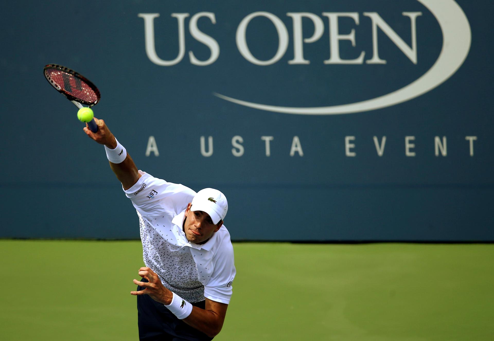 American John Isner serves during a match at the 2014 US Open. Isner is only one of two Americans among the top 50 men's players, and has never appeared in the final of a major tournament.