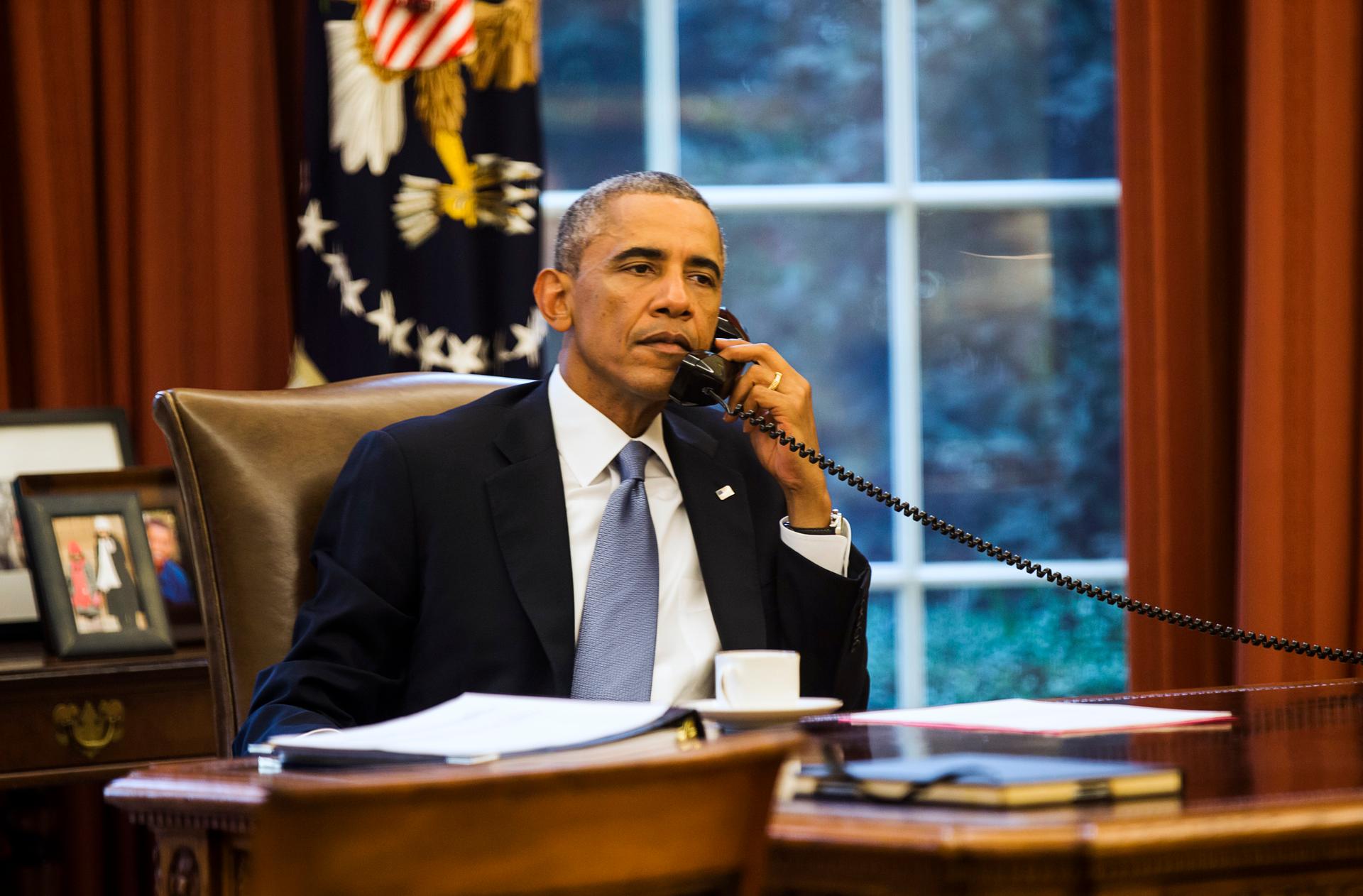 President Obama speaks on the phone Tuesday with Saudi Arabia's King Abdullah from the Oval Office. The administration says it’s building a coalition to fight the Islamic State movement.