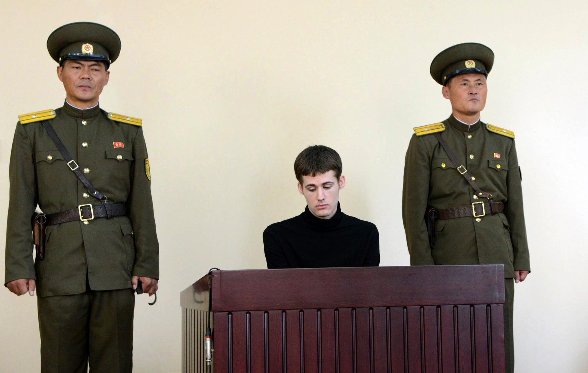 U.S. citizen Matthew Todd Miller sits in a witness box during his trial at the North Korean Supreme Court in this undated photo released by North Korea's Korean Central News Agency (KCNA) in Pyongyang September 14, 2014. 