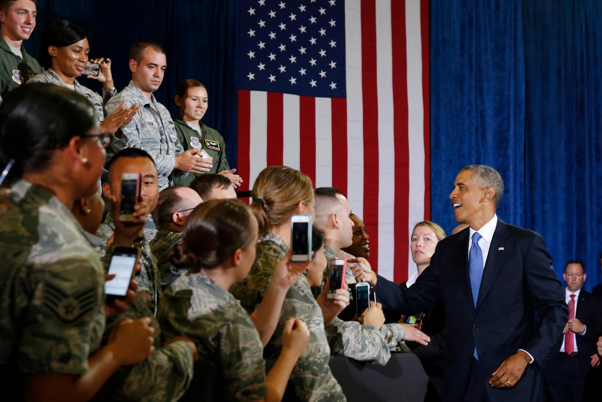 President Barack Obama shakes hands before speaking at MacDill Air Force Base in Tampa, Florida.