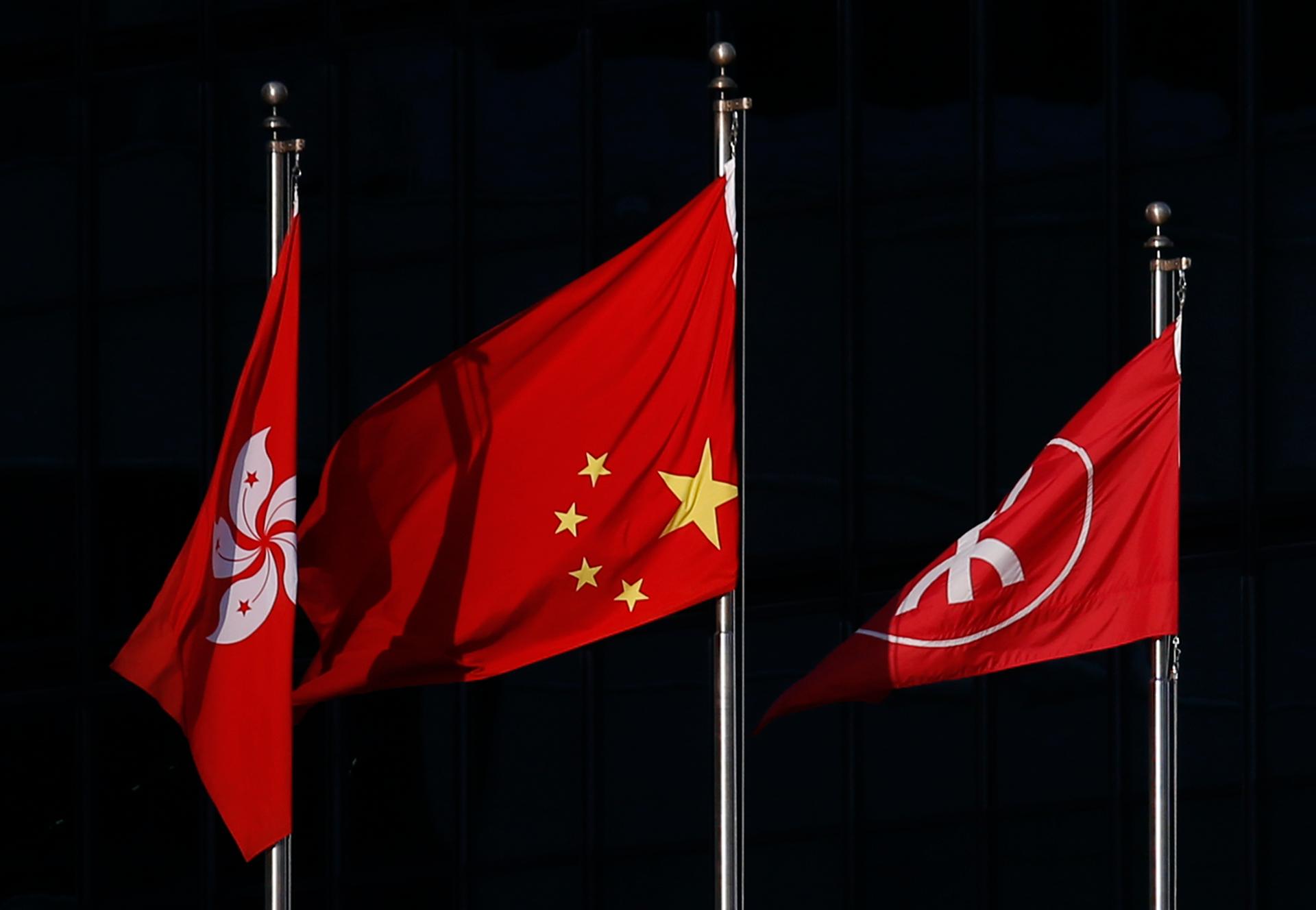 A Chinese national flag, at center, flies upside down on September 29, 2014. Chinese living in mainland China know very little of the pro-democracy protests taking place in Hong Kong. 