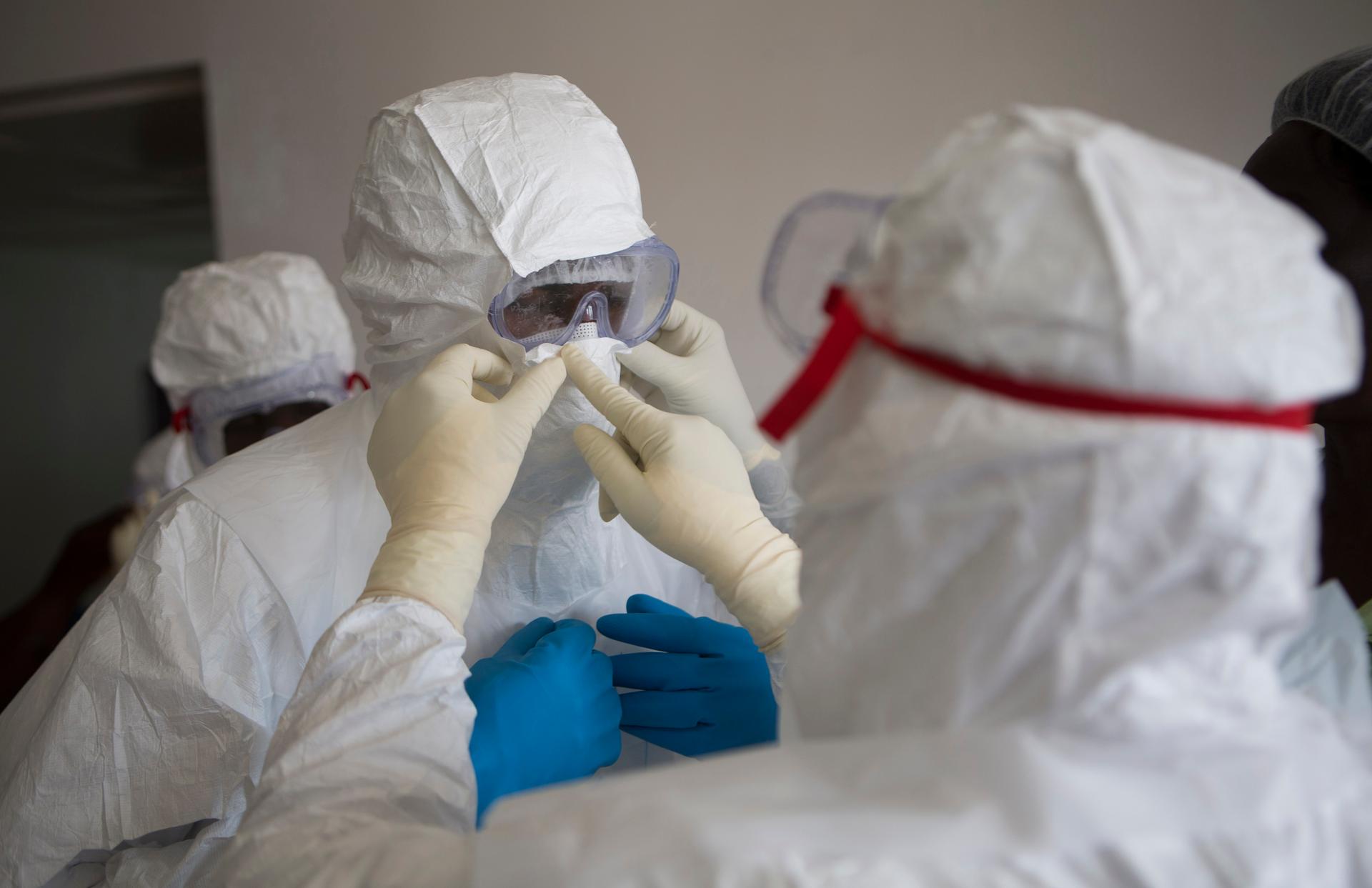 Health workers wearing protective equipment are pictured at the Island Clinic in Monrovia, Liberia on September 30, 2014, where patients are treated for Ebola. 