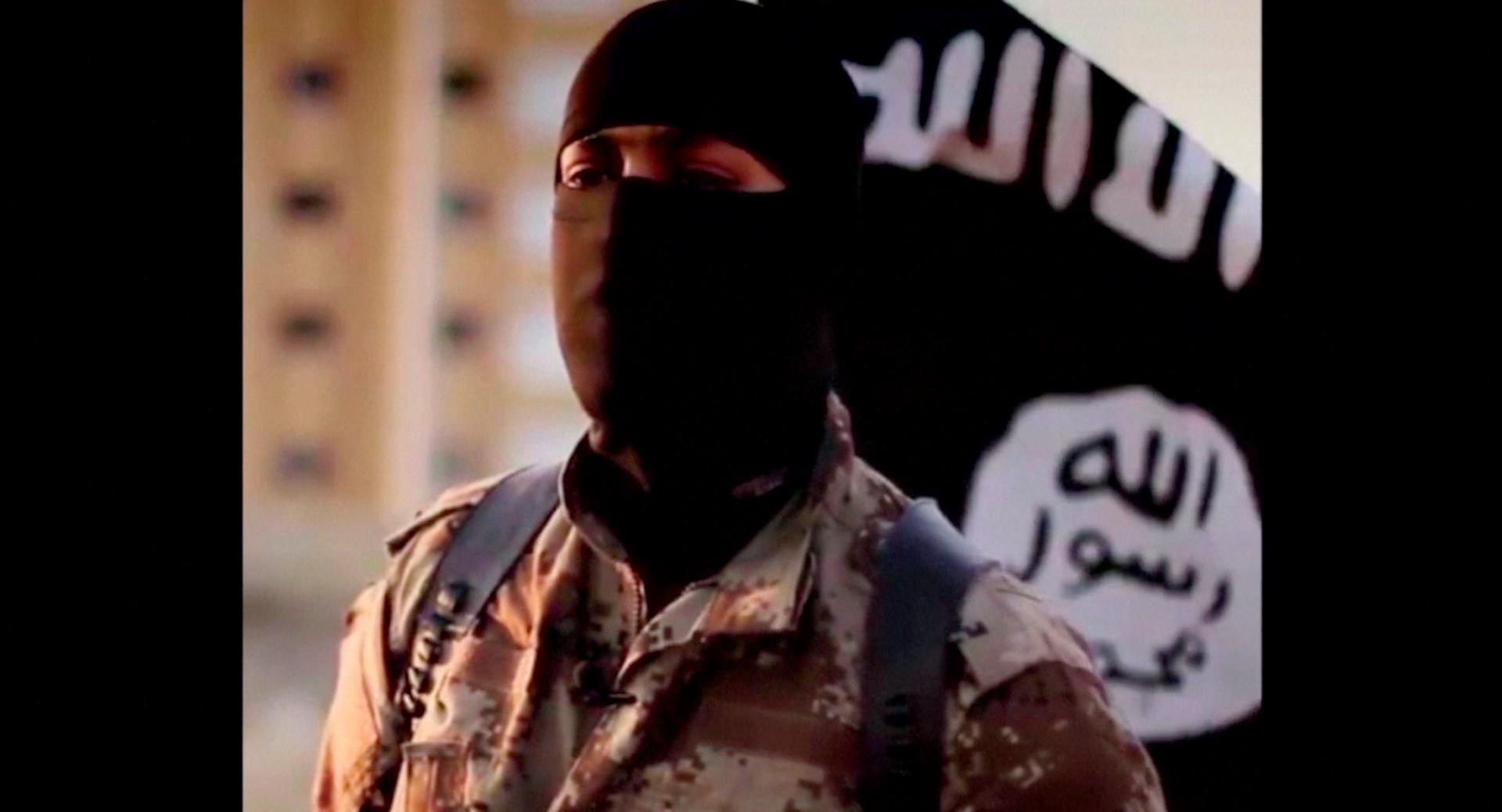 A masked man speaking in what is believed to be a North American accent is pictured in a video that ISIS militants released in September 2014.