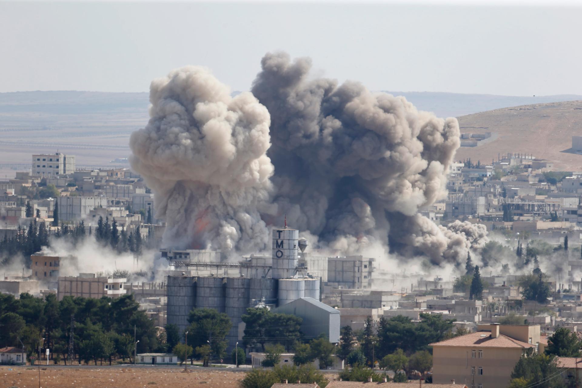 Smoke rises after a US-led air strike in the Syrian town of Kobane on October 8, 2014.