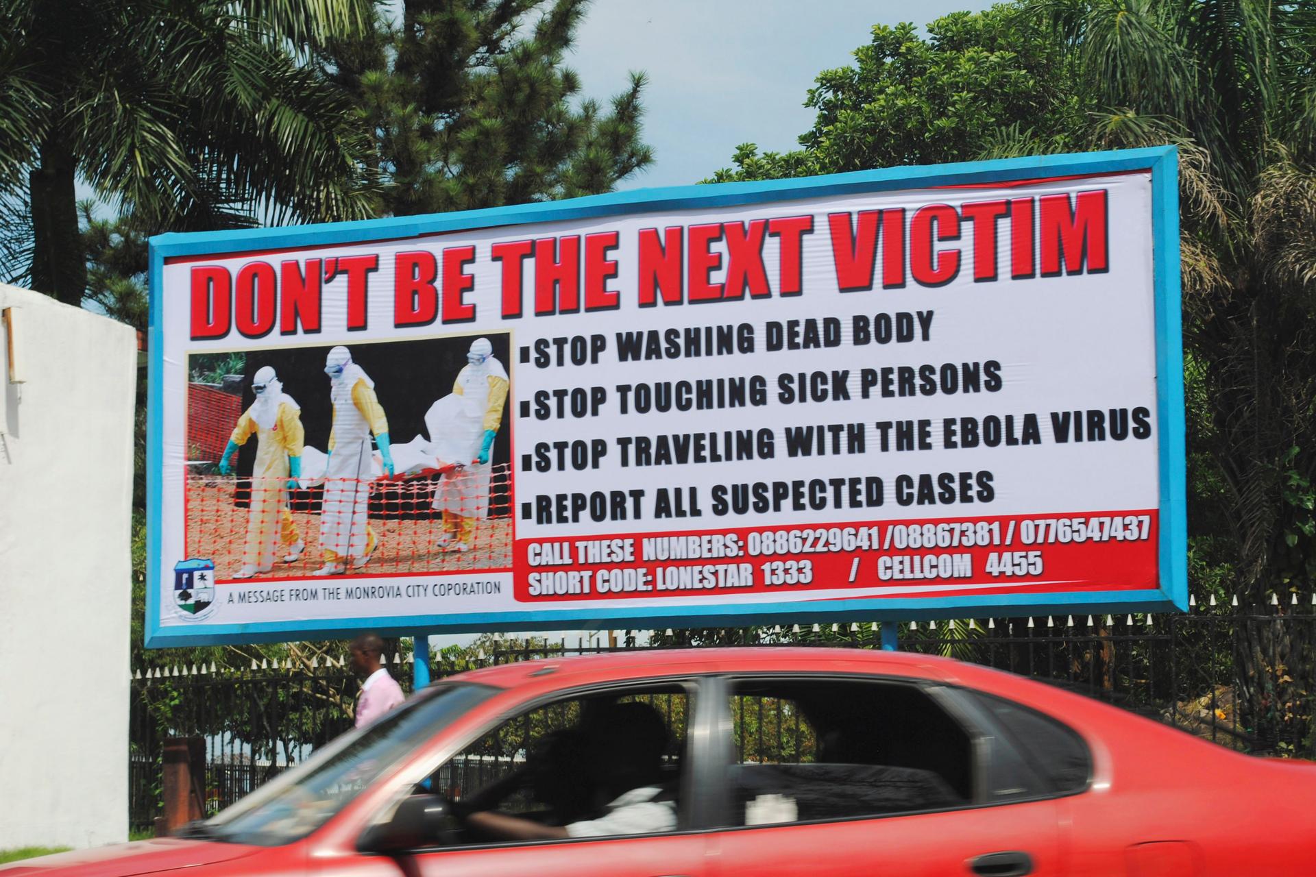 A billboard in Liberia's capital Monrovia offers advice on how to halt the spread of Ebola. 