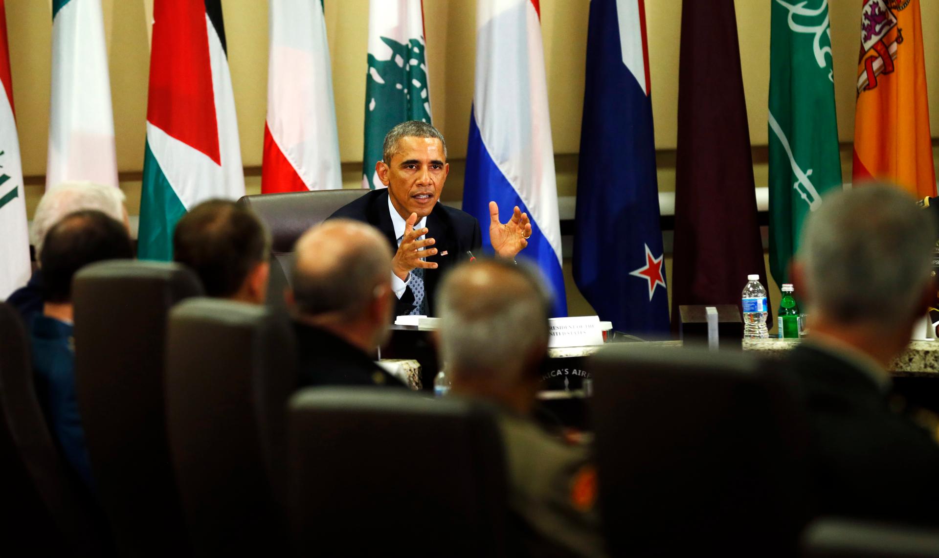 US President Barack Obama speaks at a meeting with more than 20 foreign defense chiefs to discuss the coalition efforts in the ongoing campaign against ISIS at Joint Base Andrews in Washington on October 14, 2014.